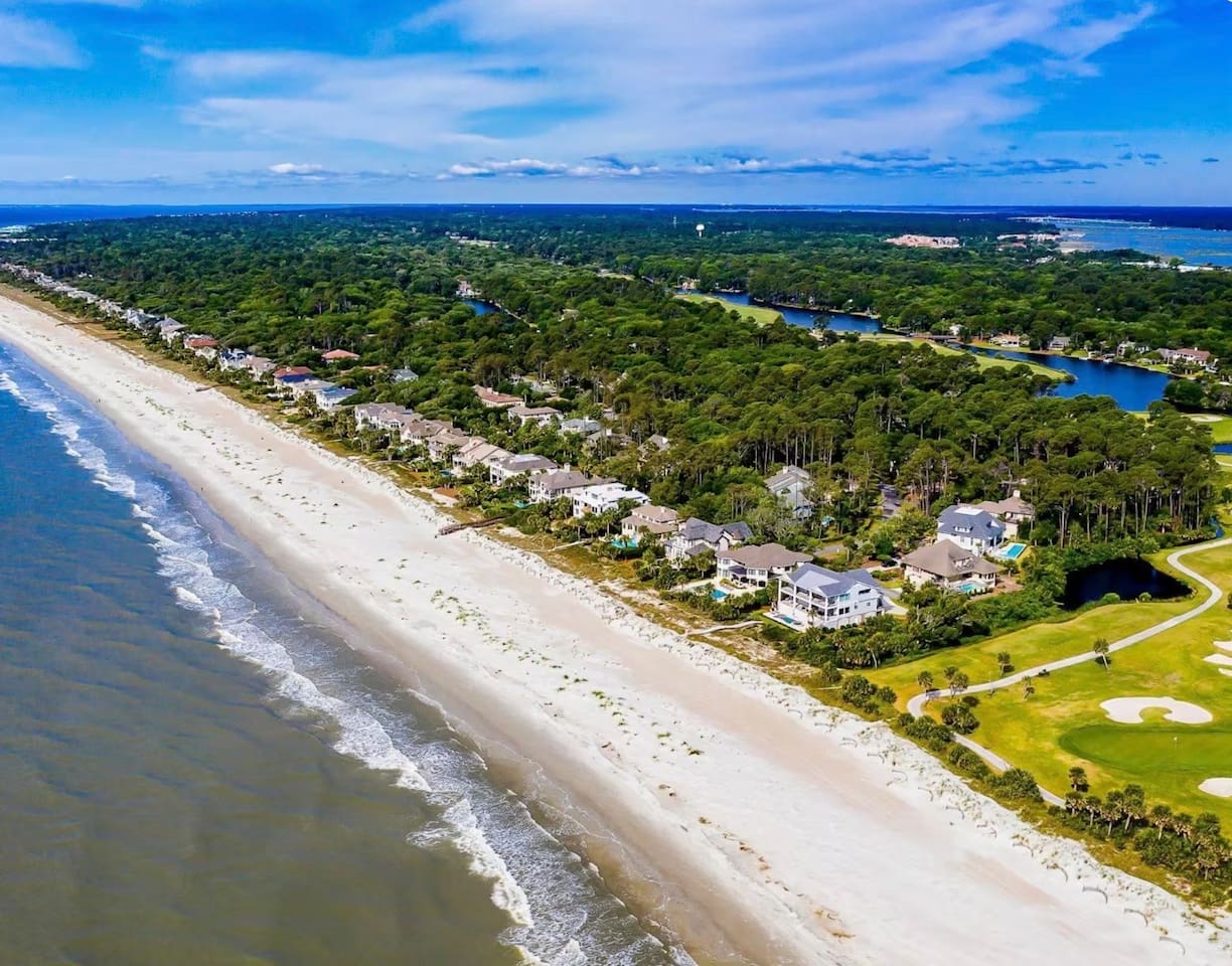 Beachfront and golf course from above