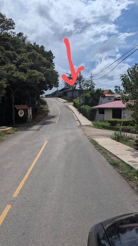 You will see this view as you follow Google or Waze directions to "Casiitas La Esquina". True to it's name, it is the house on the corner. Google says "you destination is on the left, but it is on the right as shown by the big red arrow in the pic.