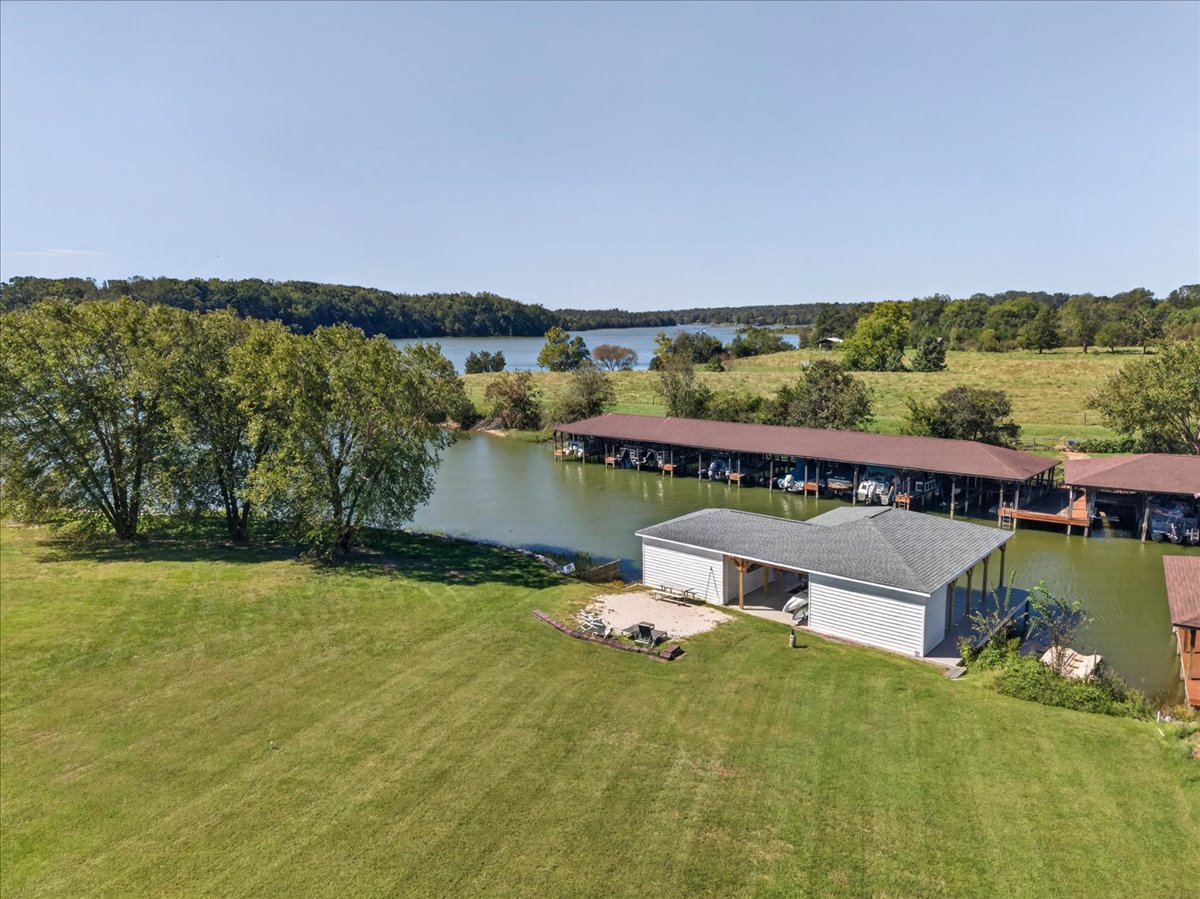 The perfect spot: sandy beach, boathouse, and quiet lake cove.