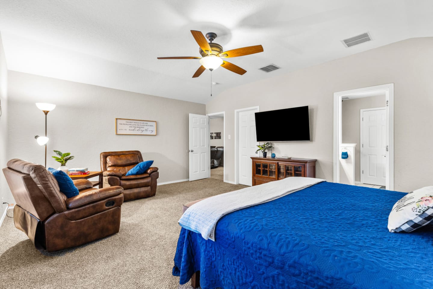 Oversized primary suite featuring a king bed, cozy reading nook, blackout shades, premium bedding, and a streaming-ready Smart TV for the perfect unwind.