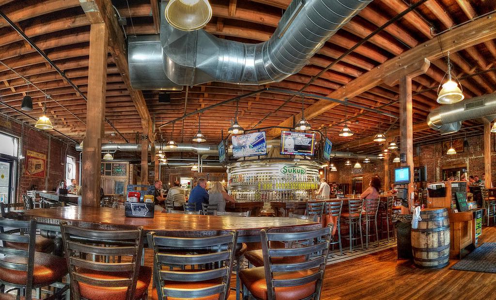 Try 100+ Iowa craft beers at The Iowa Taproom, just down the street. Great vibes, food, and a historic brick-and-beam setting.