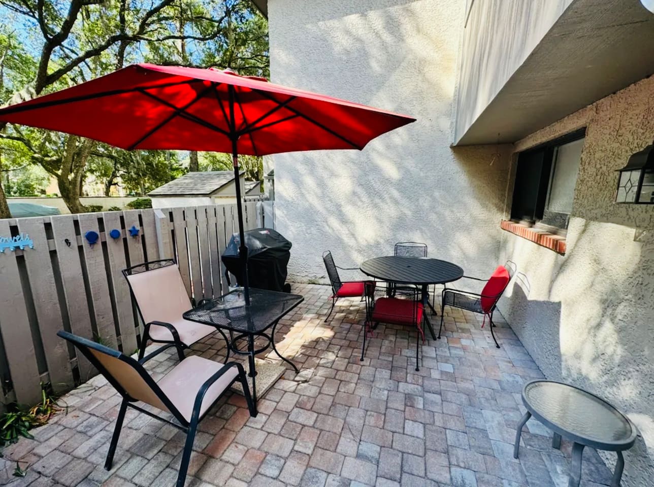 Patio with umbrella and grill