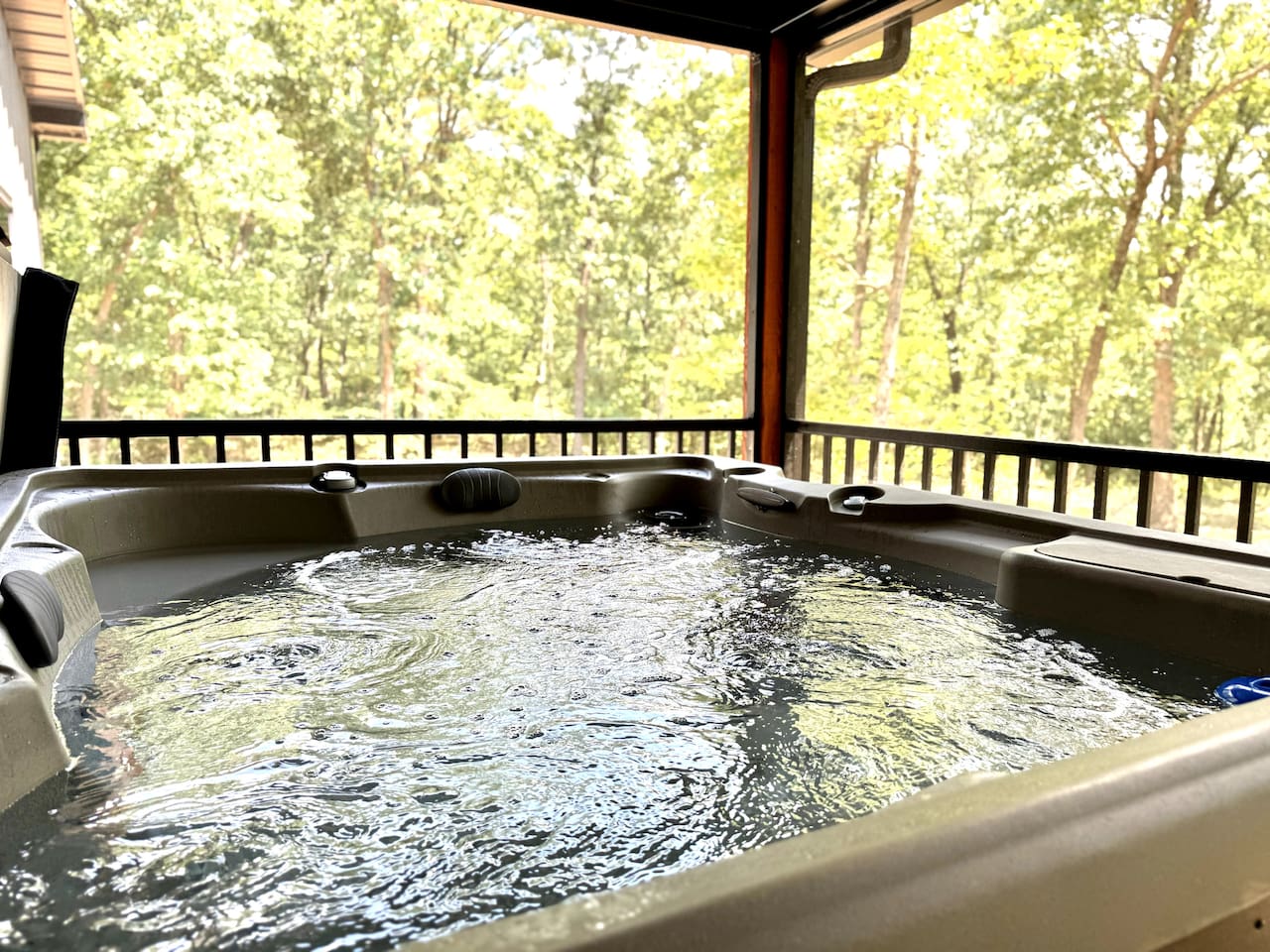Sit in the four-person hot tub surrounded by a wooded lot and enjoy the sights and sounds of nature bug-free on the screened-in porch. 