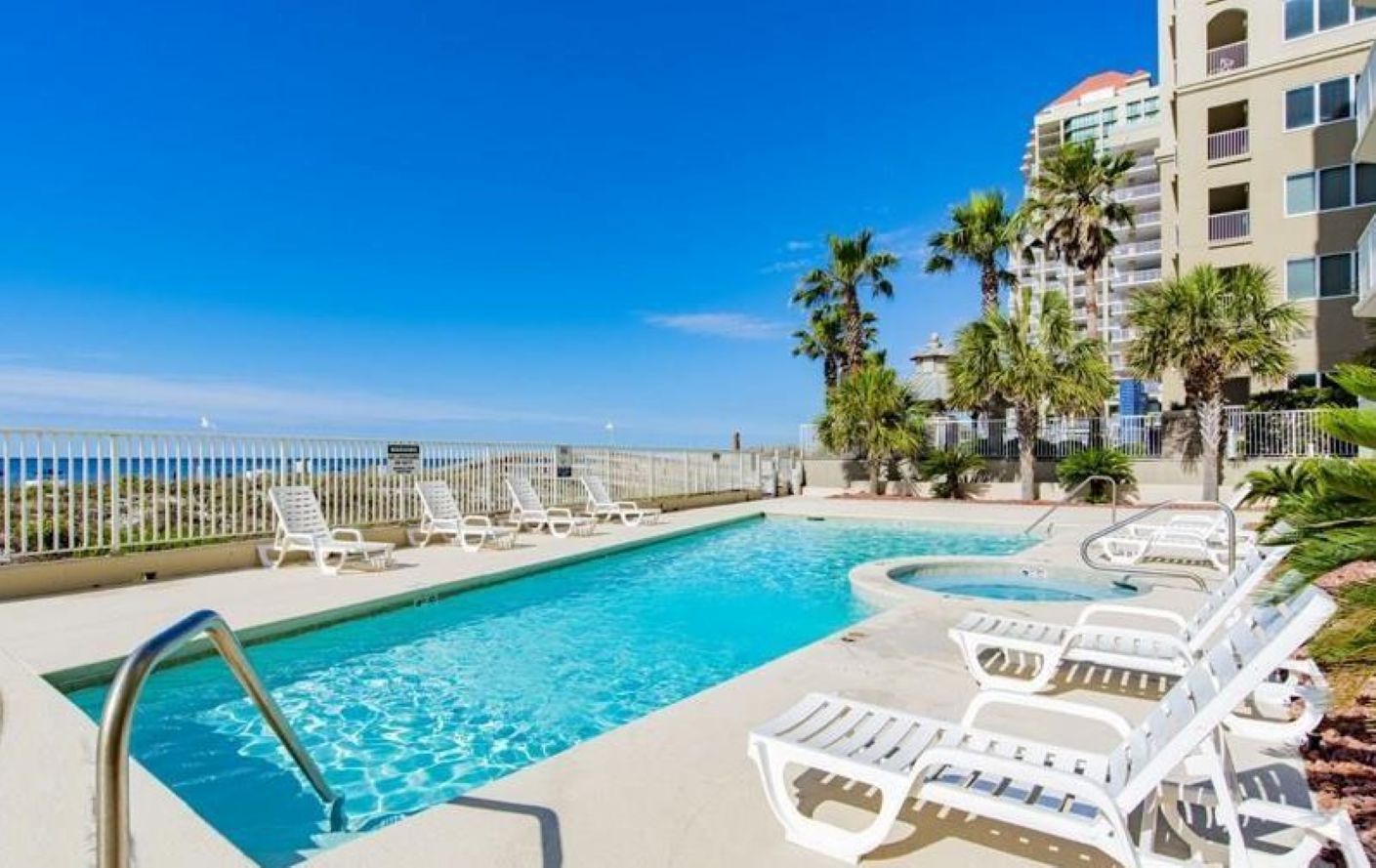 Where the pool meets the ocean.  Enjoy a seamless blend of relaxation and recreation in this idyllic beachfront setting.