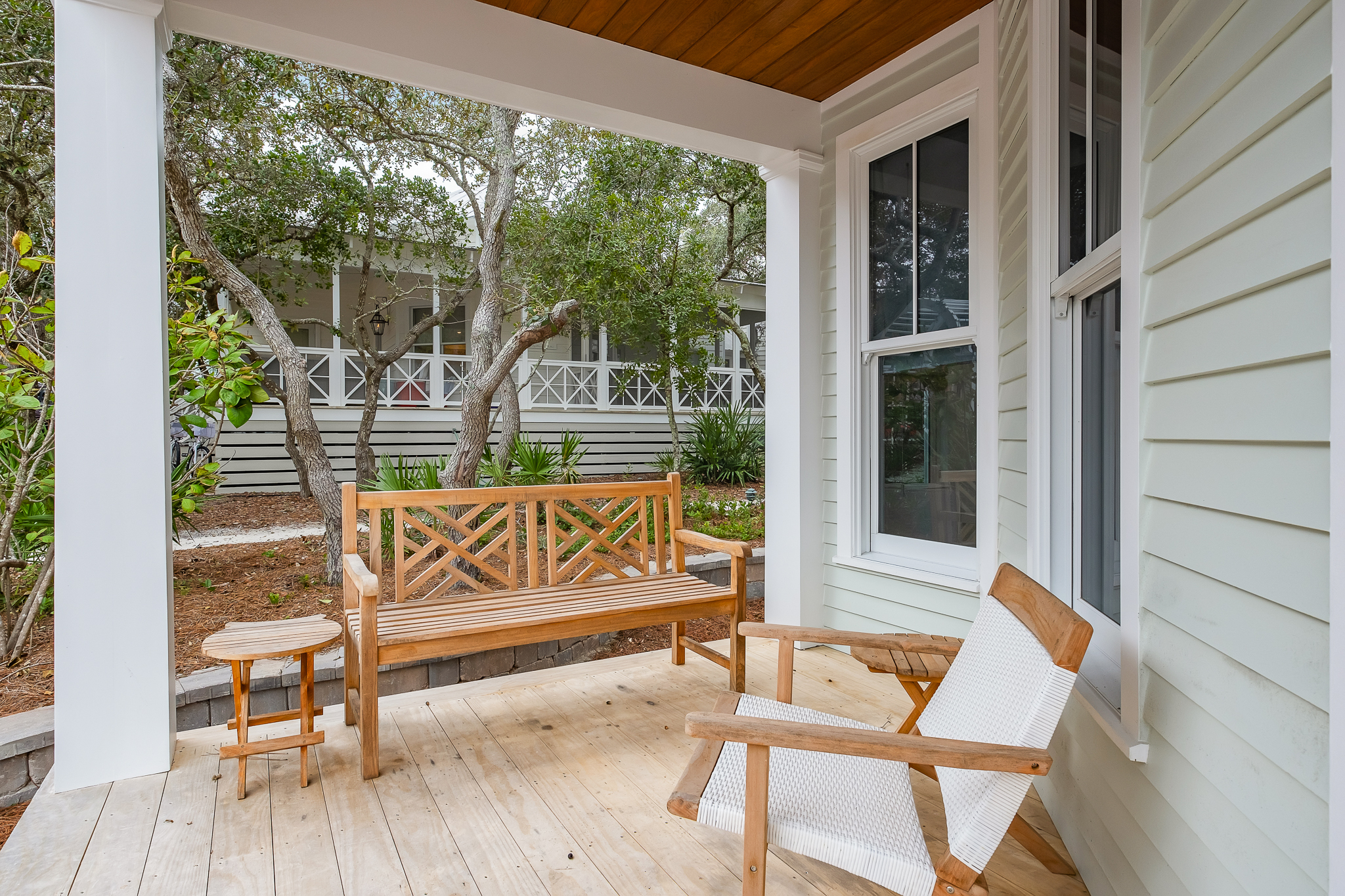 Deep front porch seating is the perfect place to relax and enjoy a book.