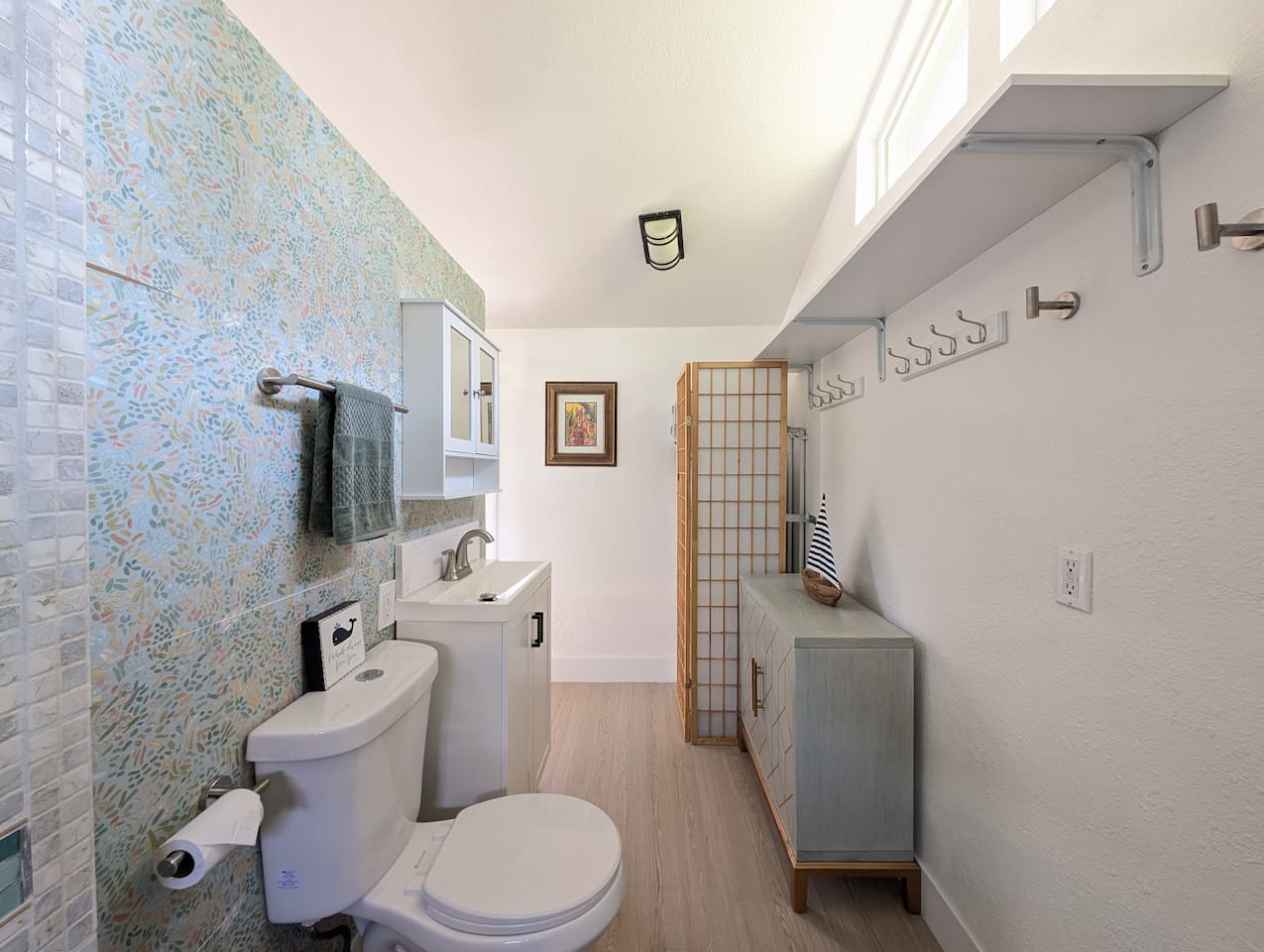 Roomy bathroom with convenient storage space.