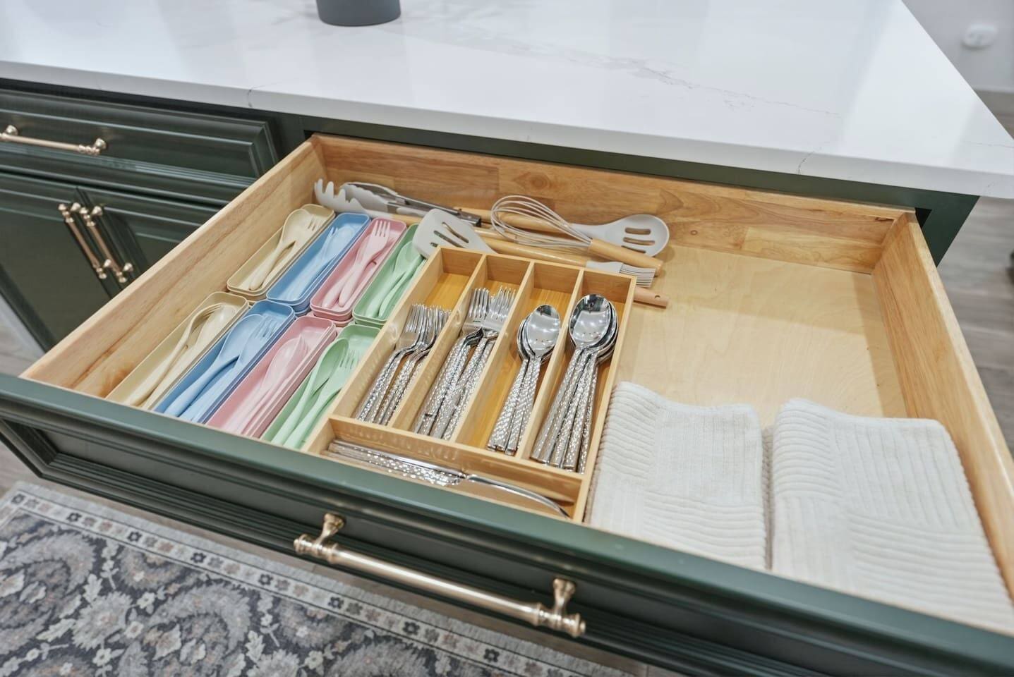Organized kitchen drawer stocked with silverware, utensils, and kid-friendly cutlery—everything you need for easy meals at home.