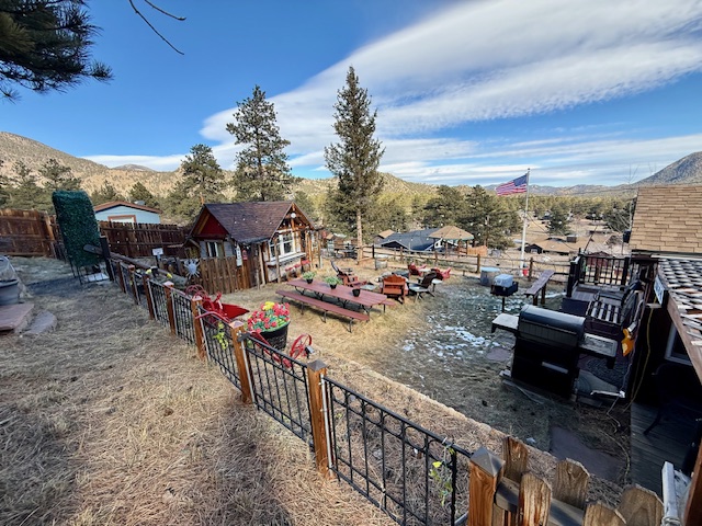 A private outdoor bar with three seats and a TV inside — ideal for slow mornings or easy evenings.