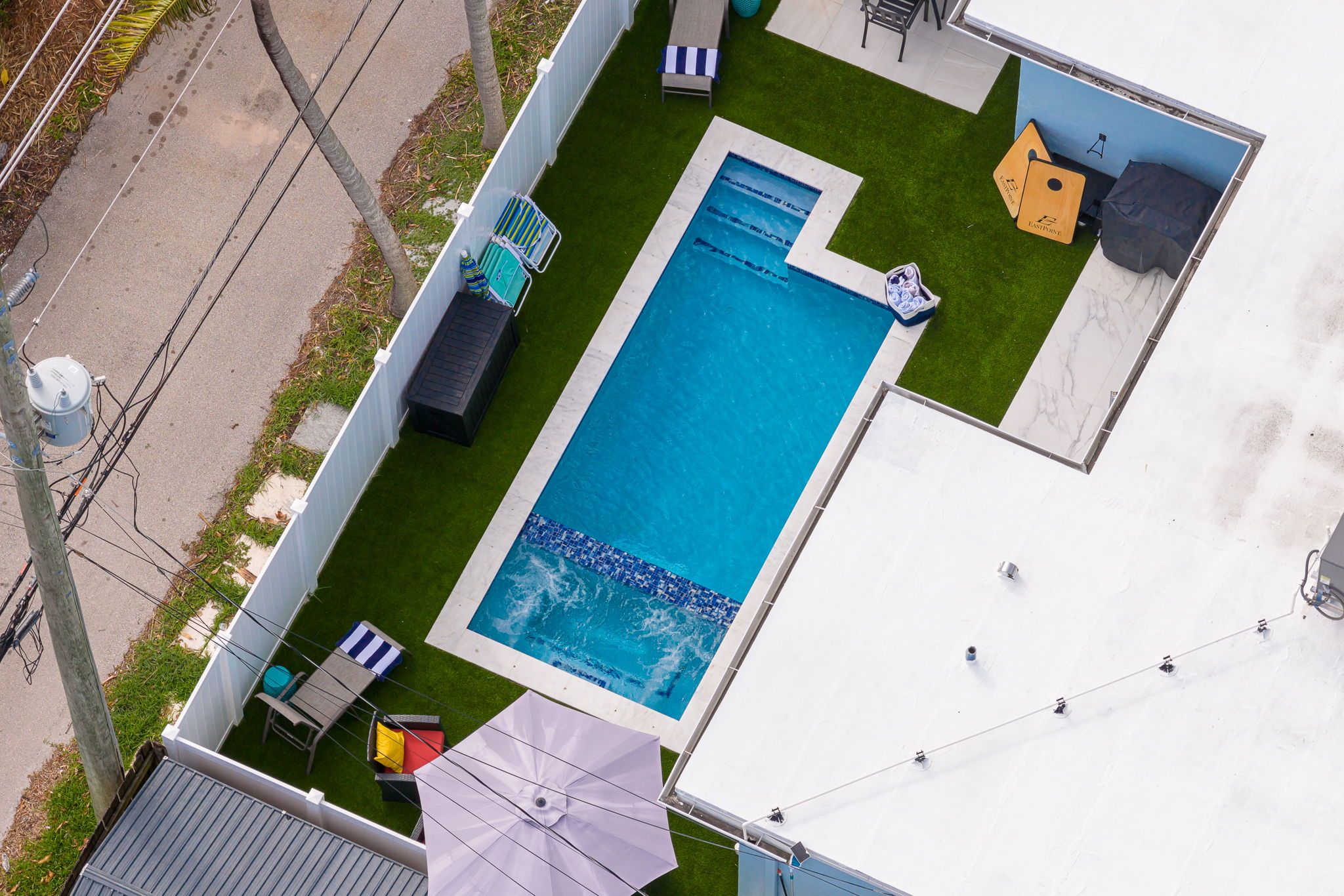 Beautiful 4 bedroom, 3 bathroom pool home in a family-friendly, safe neighborhood. Features a wide paver driveway, tropical palms, and welcoming curb appeal.