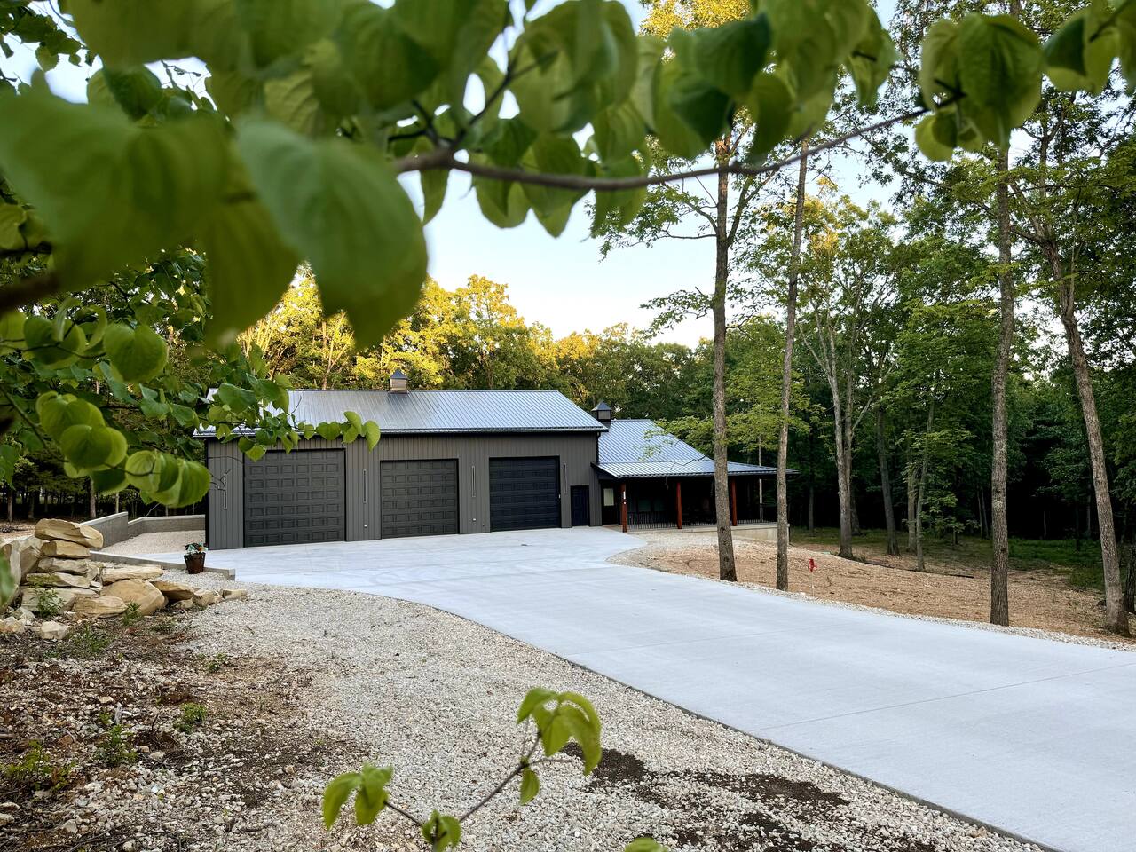 Long wide concrete driveway from the road to the door. You will be surrounded by trees on this magnificent 4-acre lot.