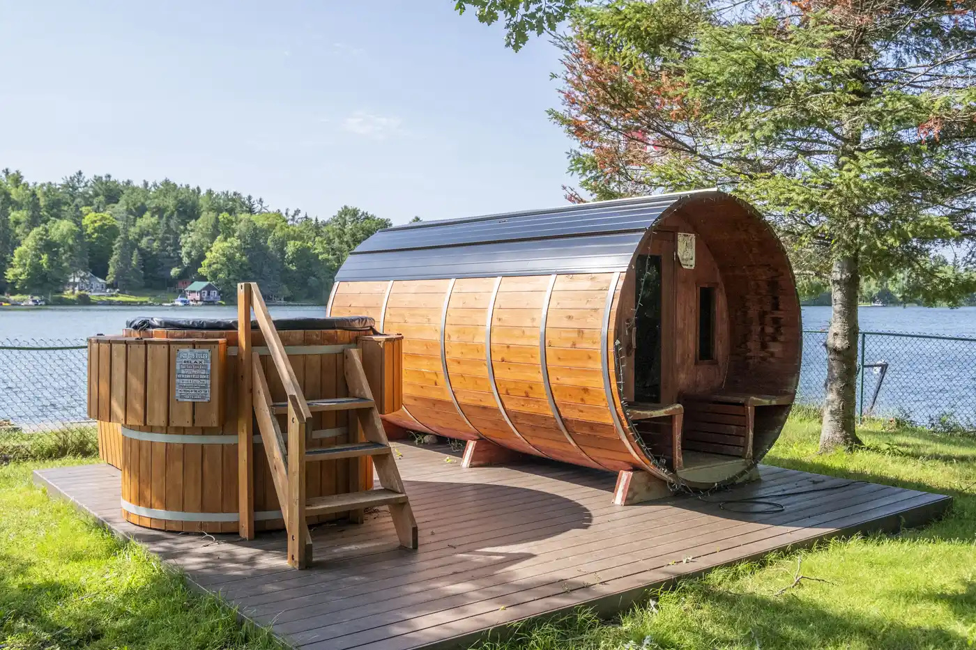 Private barrel sauna and hot tub beside Main House