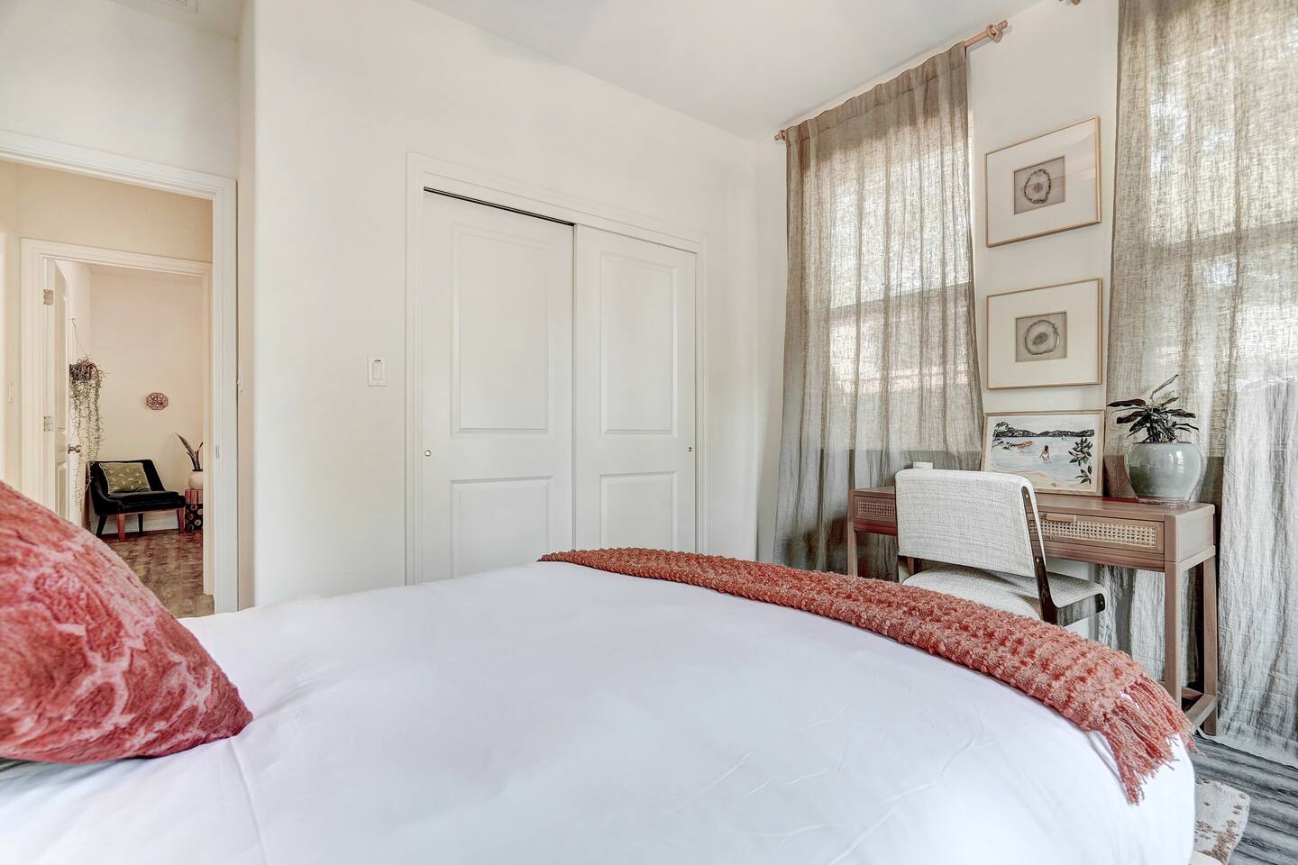 Murphy style queen bed and a work space with desk.