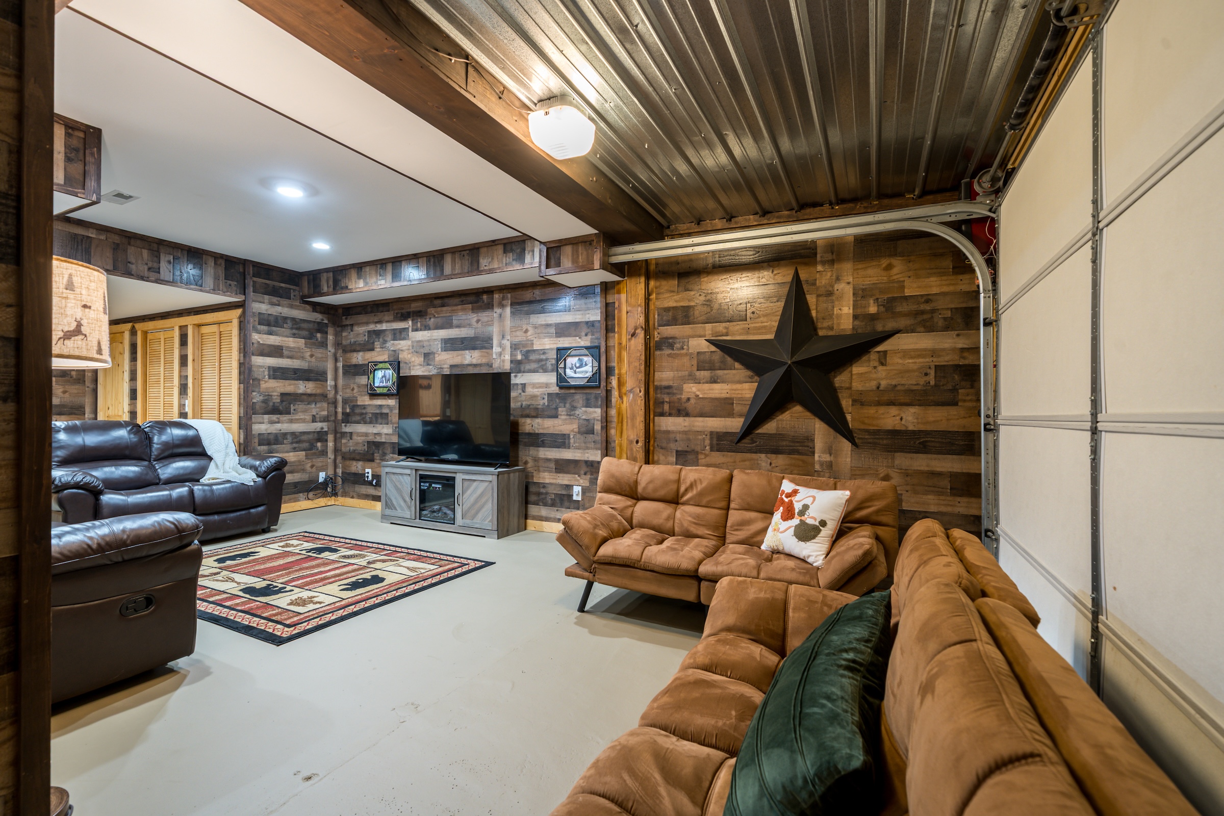 TV upstairs already in use? No worries! Settle in by the game room, switch on the electric fireplace, put on your favorite show, and stretch out — this cozy spot is all yours.