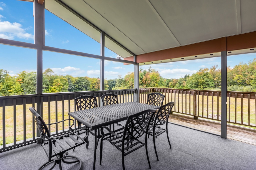 Covered Deck/Porch off upstairs livingroom overlooking field