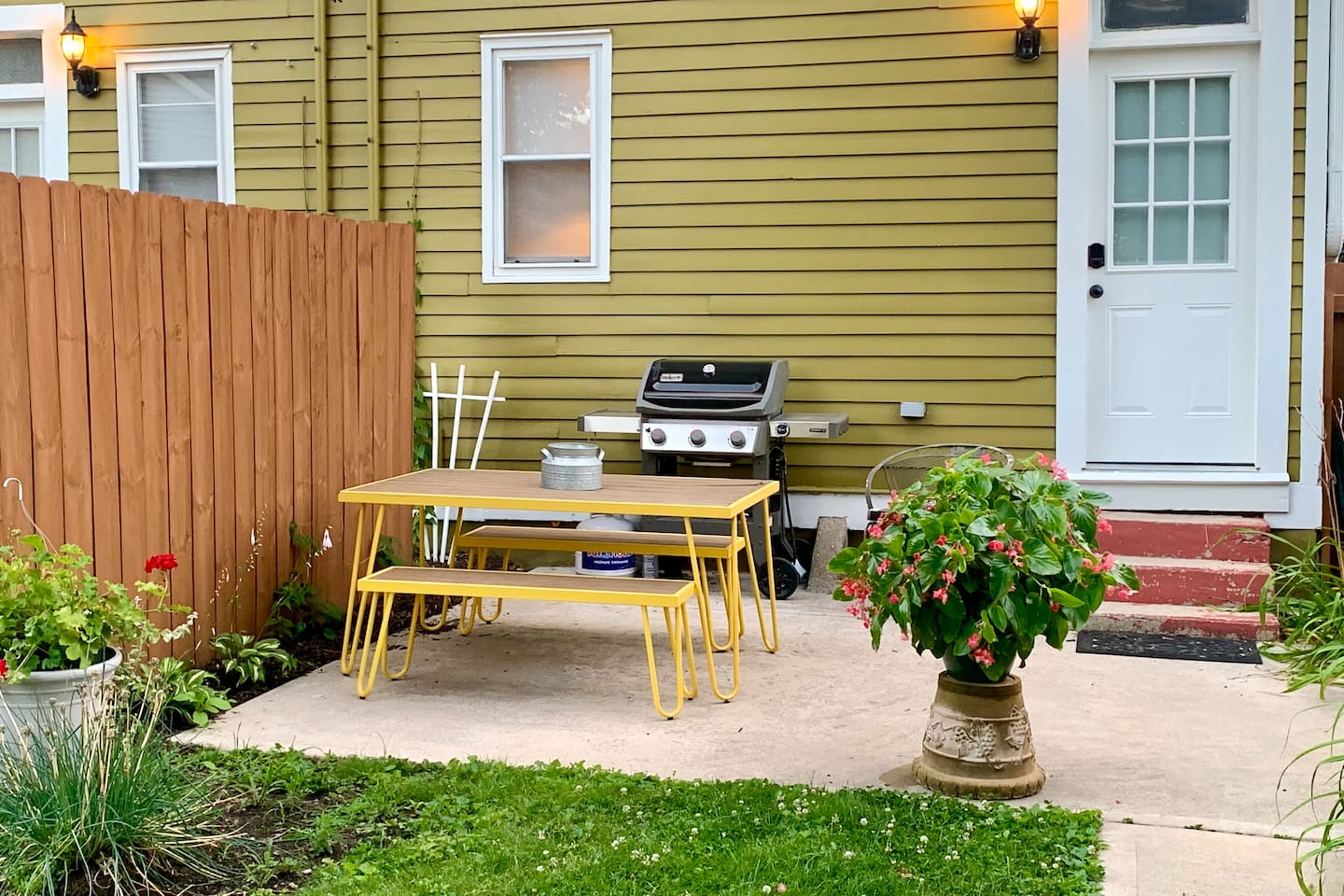 Shared, fully fenced backyard with garden patio, grill, fire pit, and dedicated off-street parking. Private gate and keyless back door entry for easy arrivals.