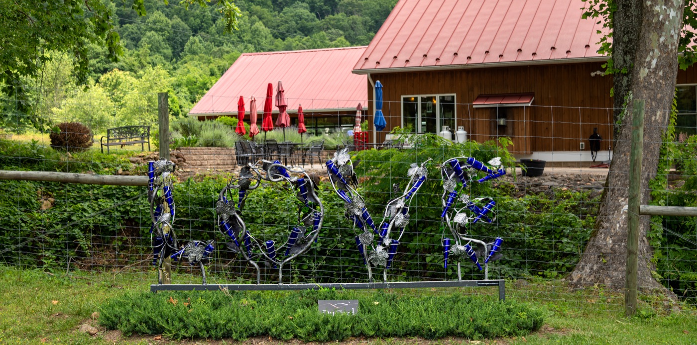 The LOVE sculpture at DuCard Vineyards, with the tasting room behind