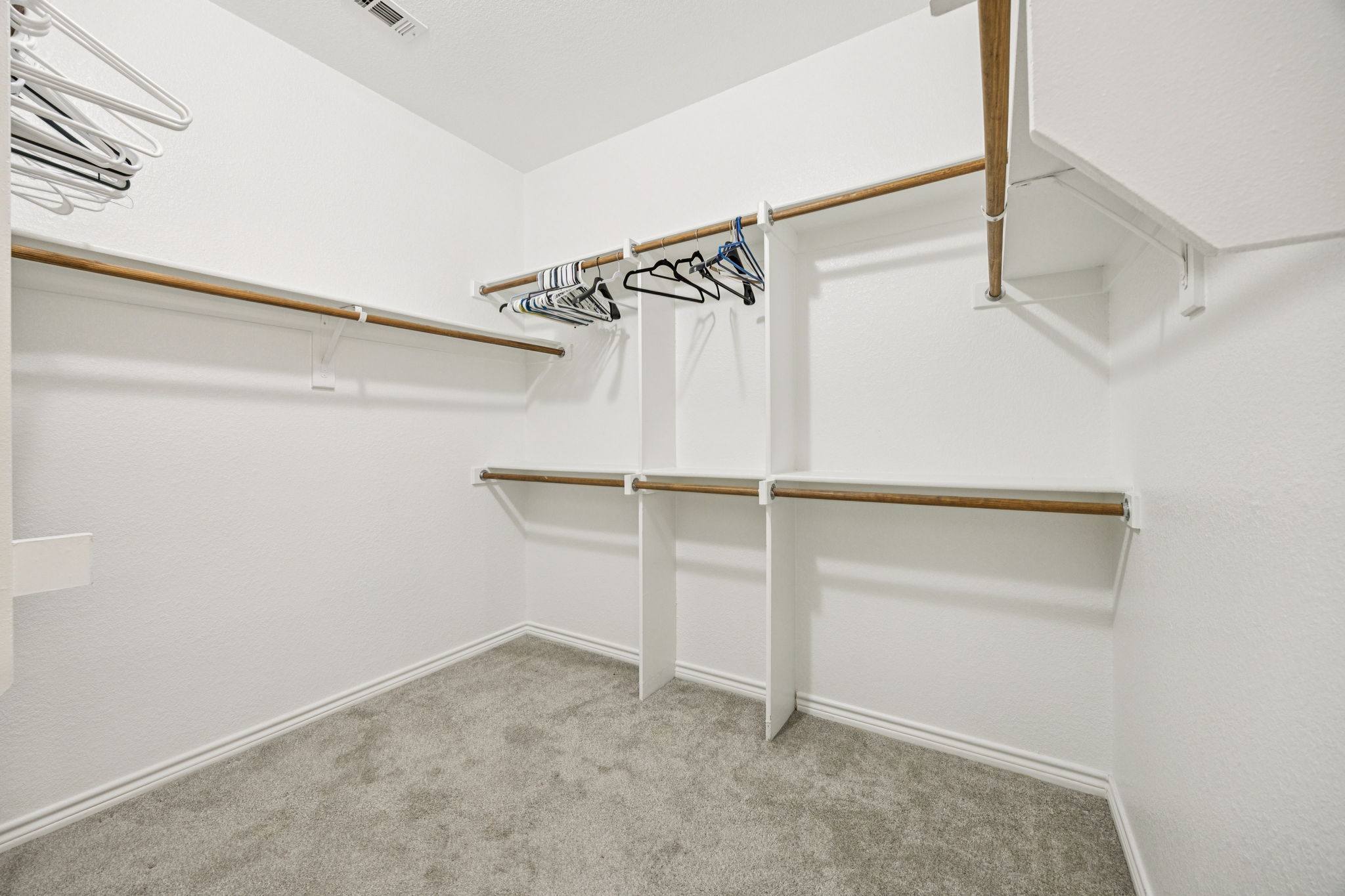 Spacious walk-in closet with room for all your travel essentials.