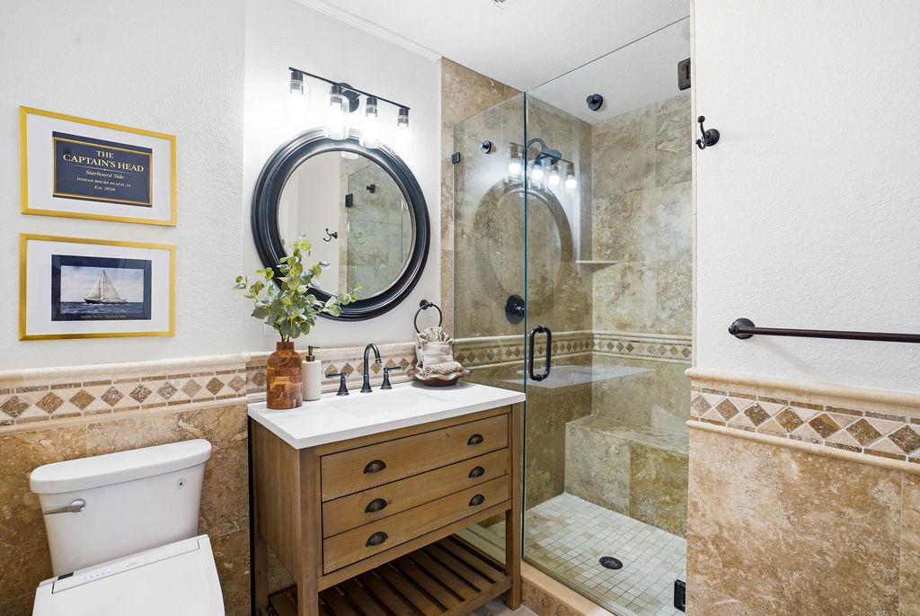Bathroom 3 with a spacious walk-in shower and coastal touches.