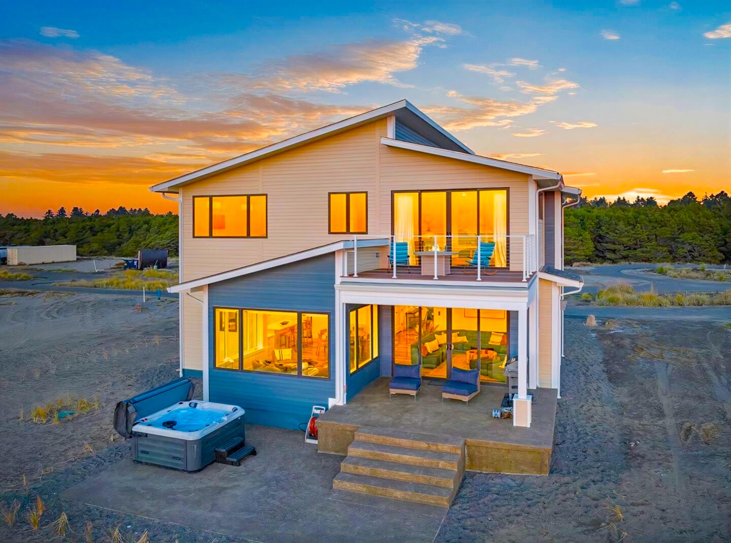{Back Patio} Patio features ocean views, hot tub, and outdoor seating. 
