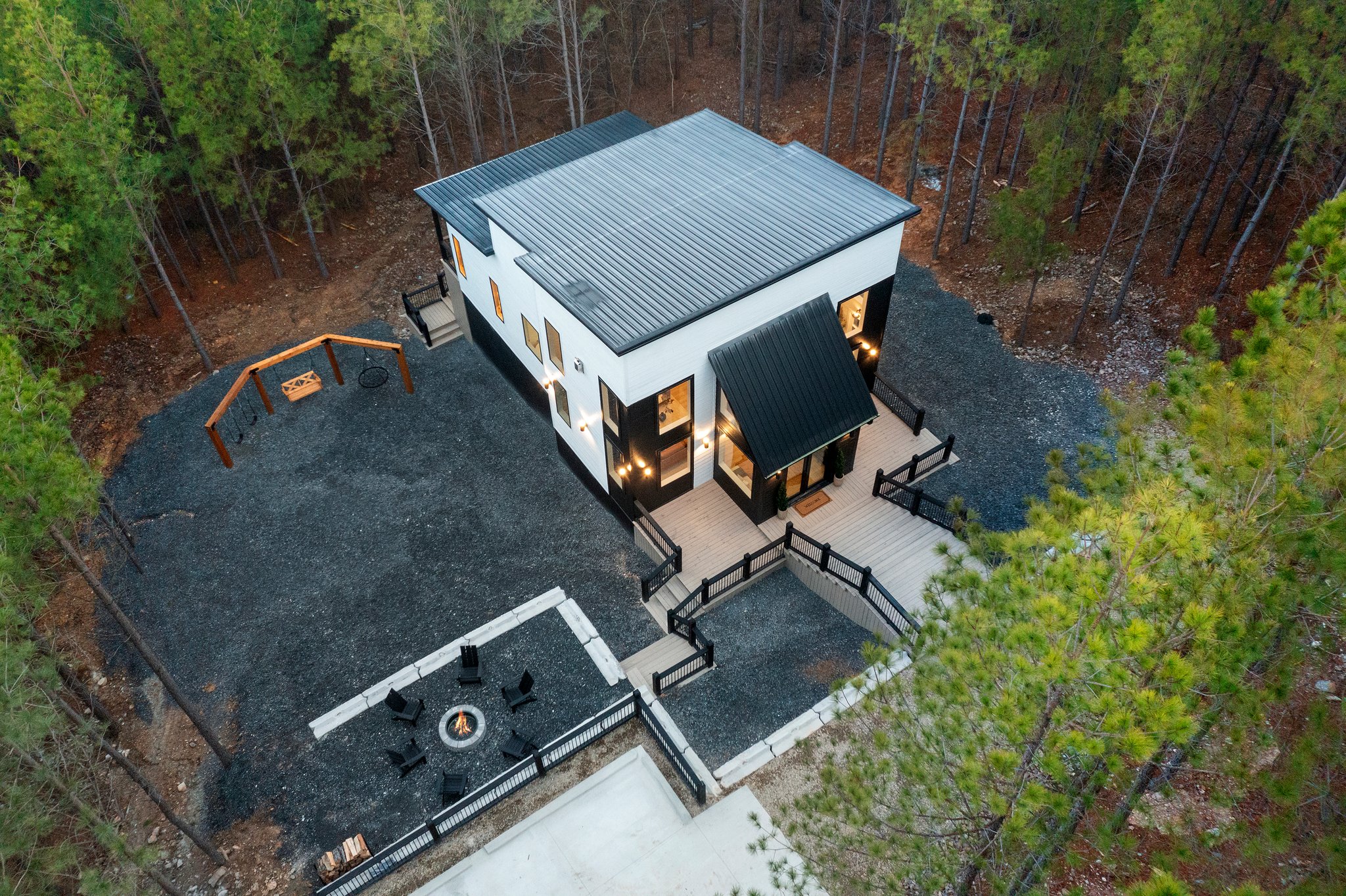 Set on a peaceful wooded lot, this home blends contemporary design with natural beauty.