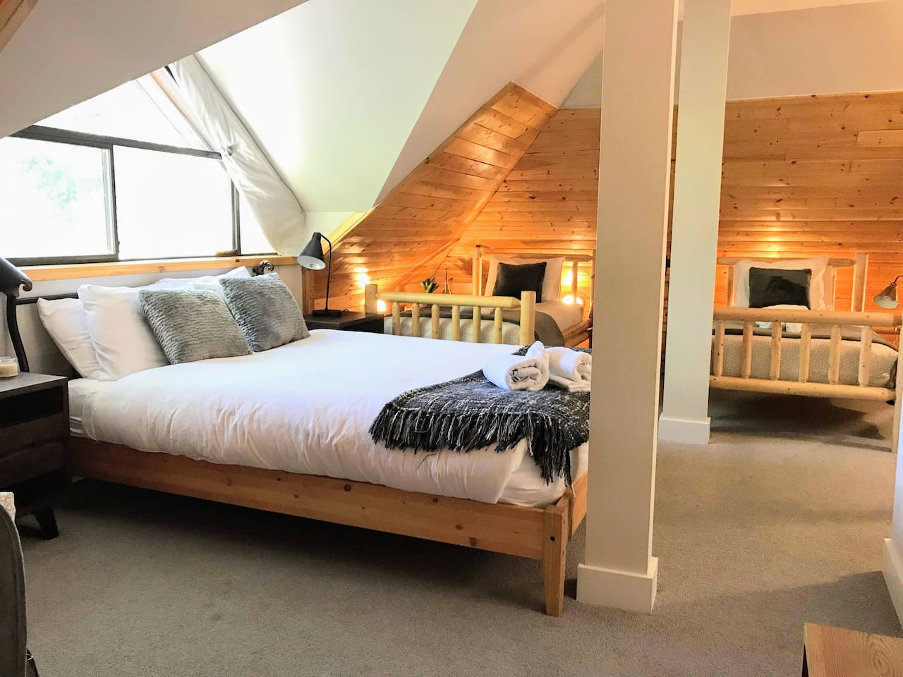 Mountain view Bedroom #4 allows you to check the Blackcomb Gondola queues from the comfort of your own bed. This top floor roost features a new ensuite bathroom & is outfitted w/ 1 queen & 2 twin beds, A/C,  Smart TV
The ultimate family room
