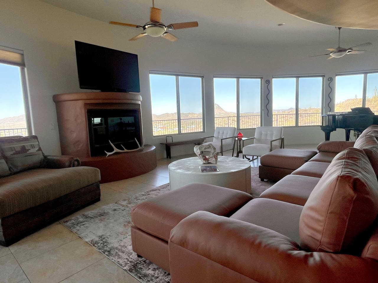 Leather seating and a fireplace make this living room a comfortable spot to unwind together.