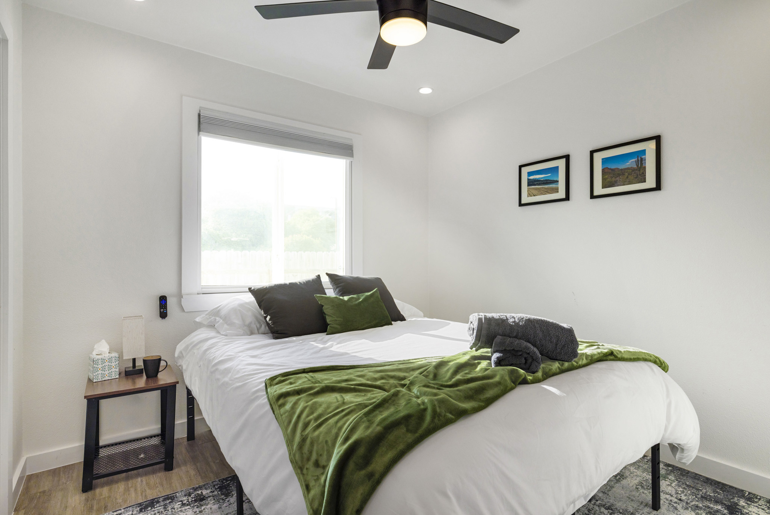 Elegant space with comfy bed, natural light, and stylish decor awaits you!