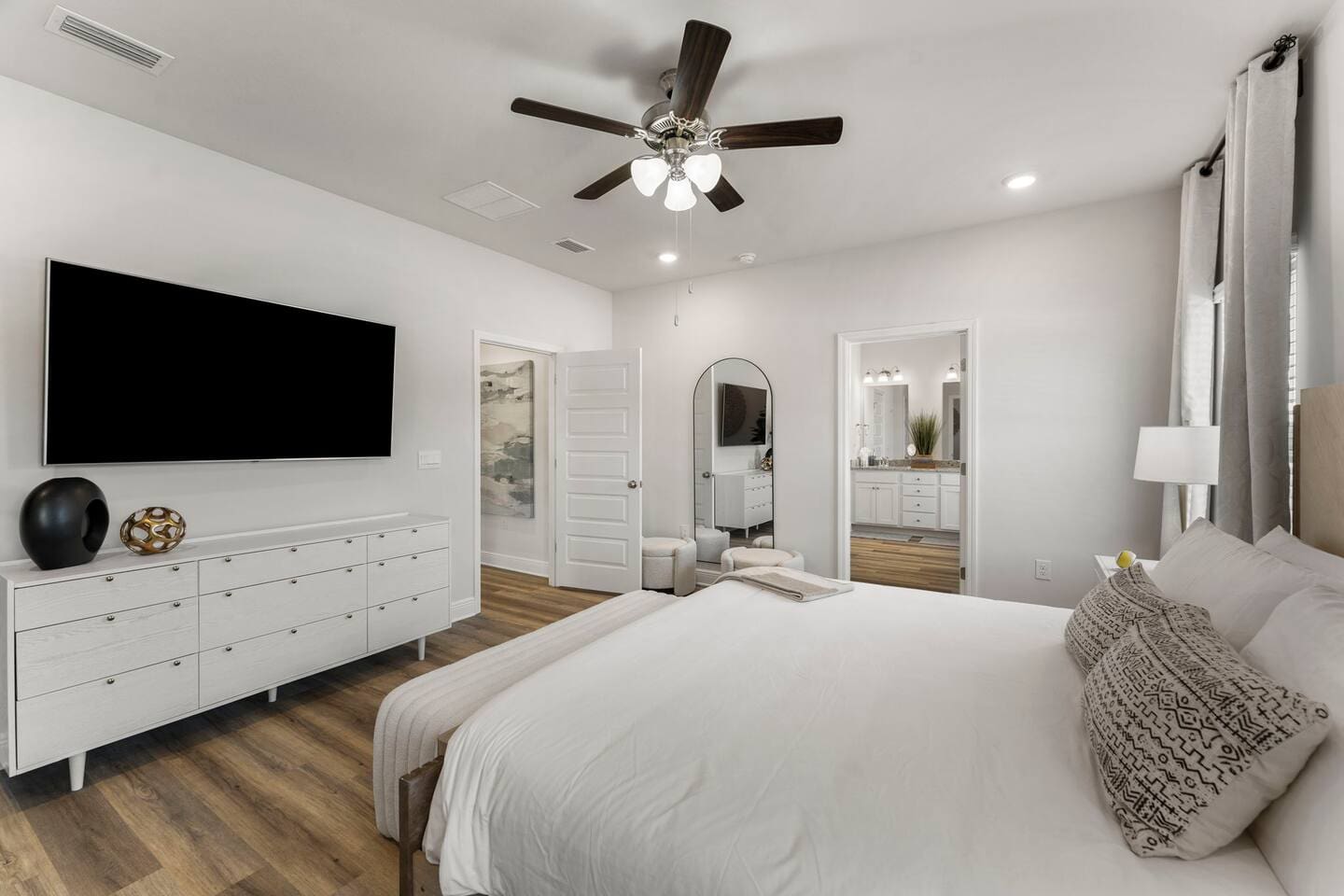 Comfort meets convenience in this bedroom with ample natural light and modern amenities.