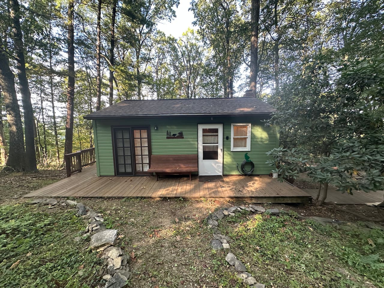 Spacious deck wraps ¾ of the way around the cabin—perfect for sipping morning coffee, enjoying dinner al fresco, or relaxing with a glass of wine. Includes a gas grill and gas fire pit for cozy evenings under the stars.
