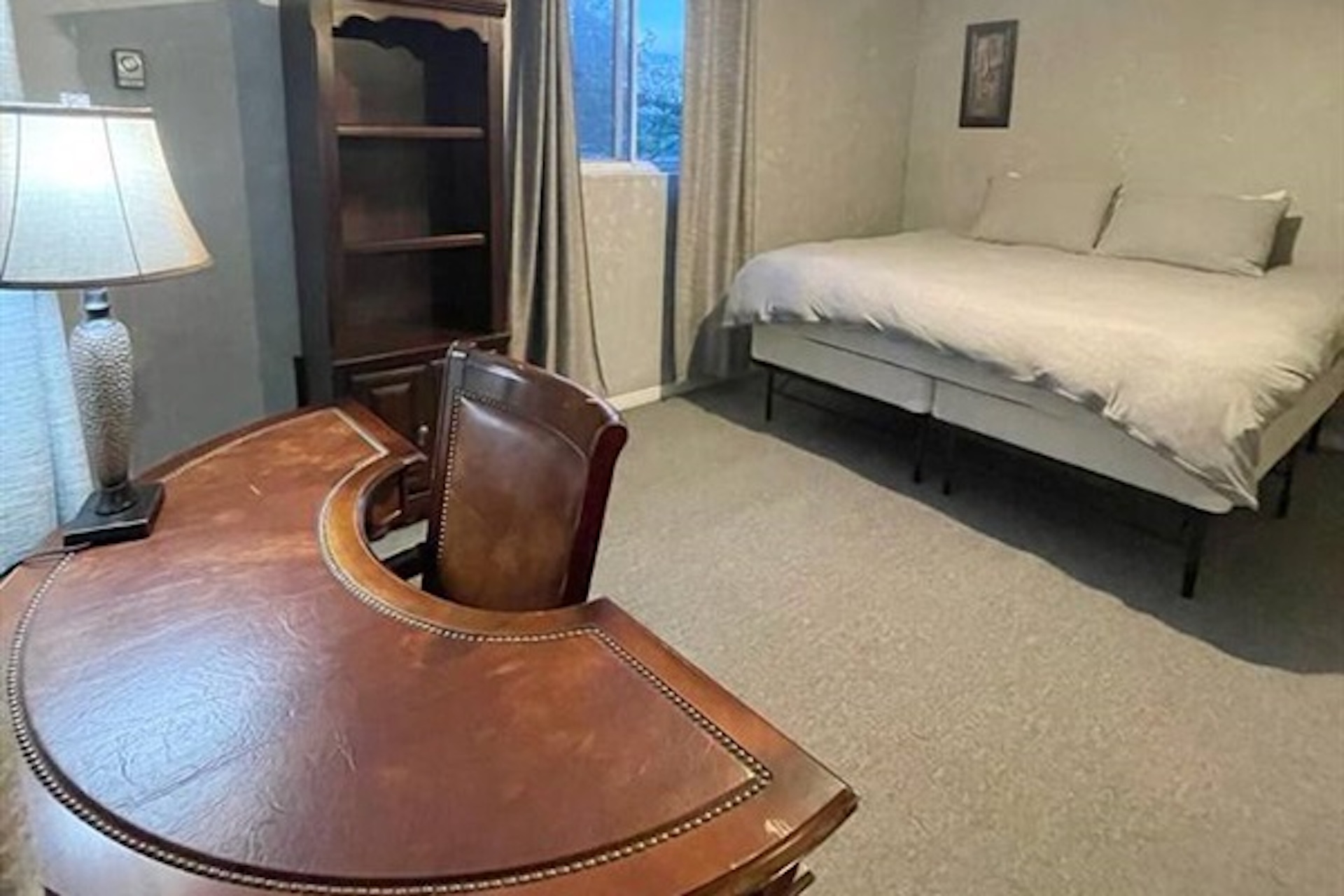 Bedroom with sofa bed and simple comfortable furnishings