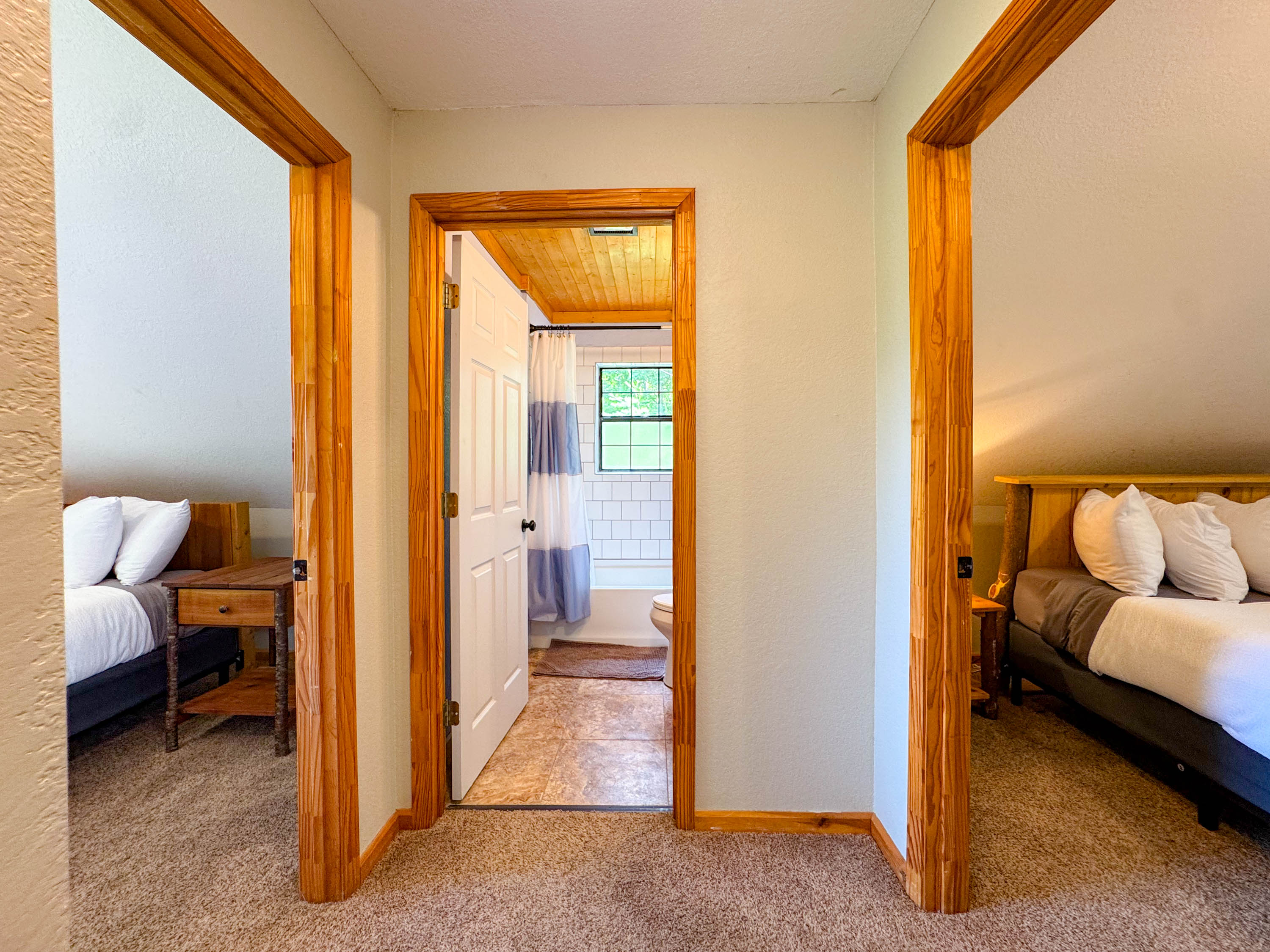 The upper level bathroom is directly between the two upstairs bedrooms. Perfect for sharing.