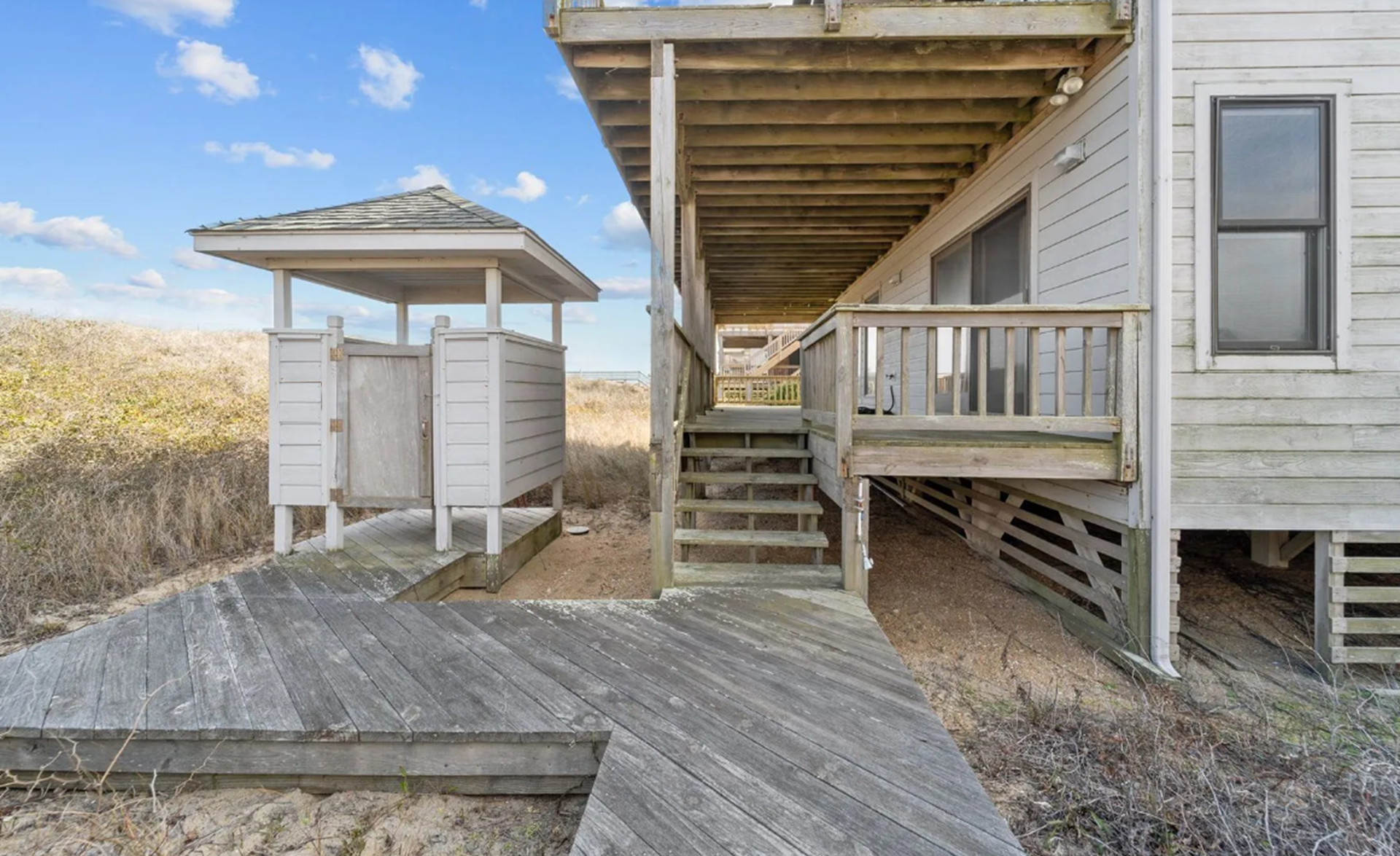 Keep your vacation house sand free with the outdoor shower and foot sprayer to rinse off after enjoying the private beach