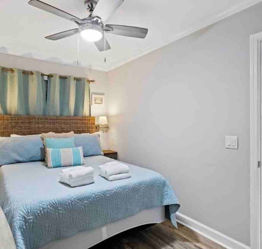 Queen bed with coastal bedding