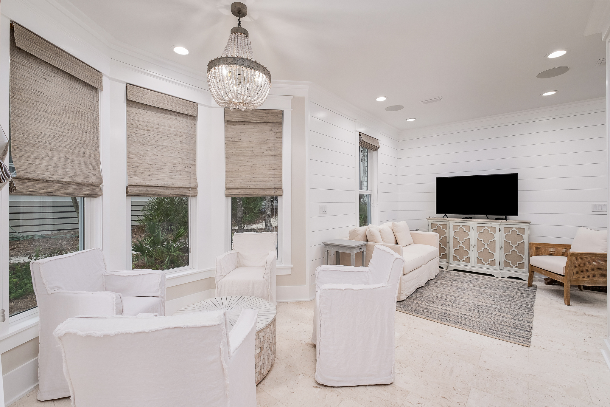 Beautiful lounge area boast 4 linen chairs.