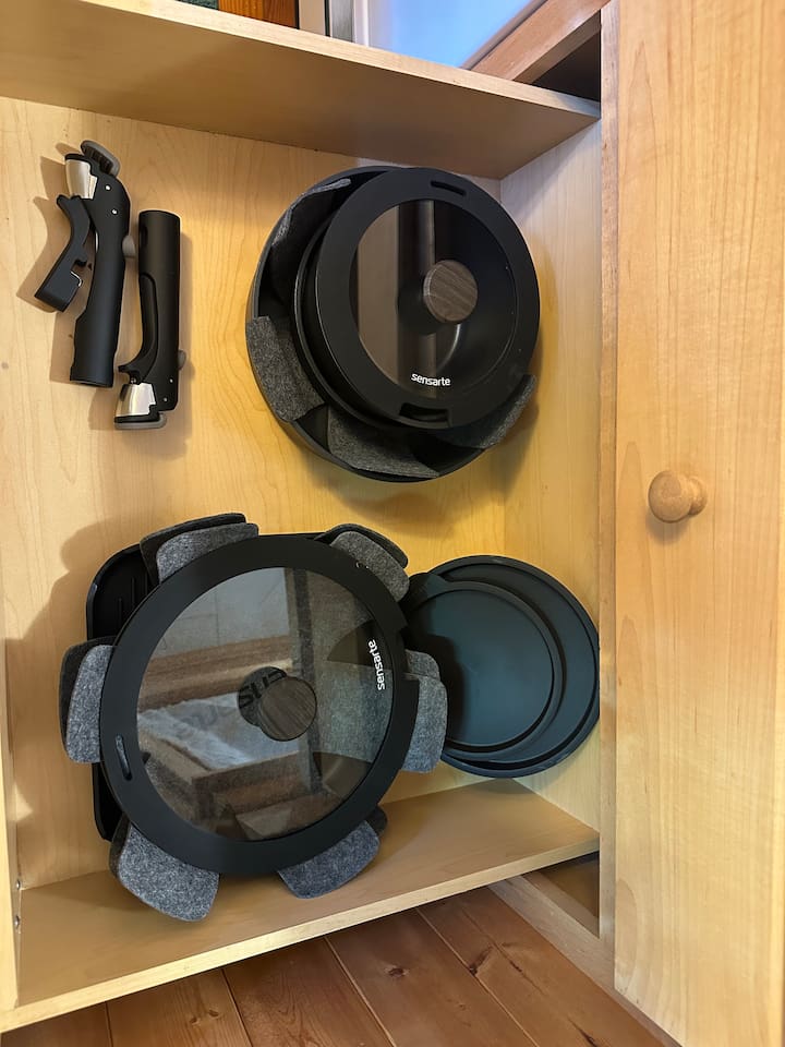 Fully stocked kitchen with everything you need—cookware, utensils, dishware, and coffee maker. Compact yet efficient, ready for cooking meals or enjoying takeout with ease.