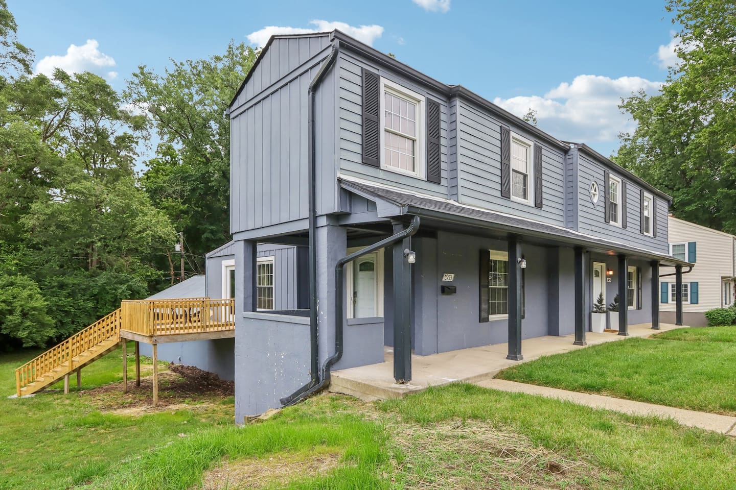 Welcome to this charming home with a spacious lawn and convenient access to the elevated outdoor deck.