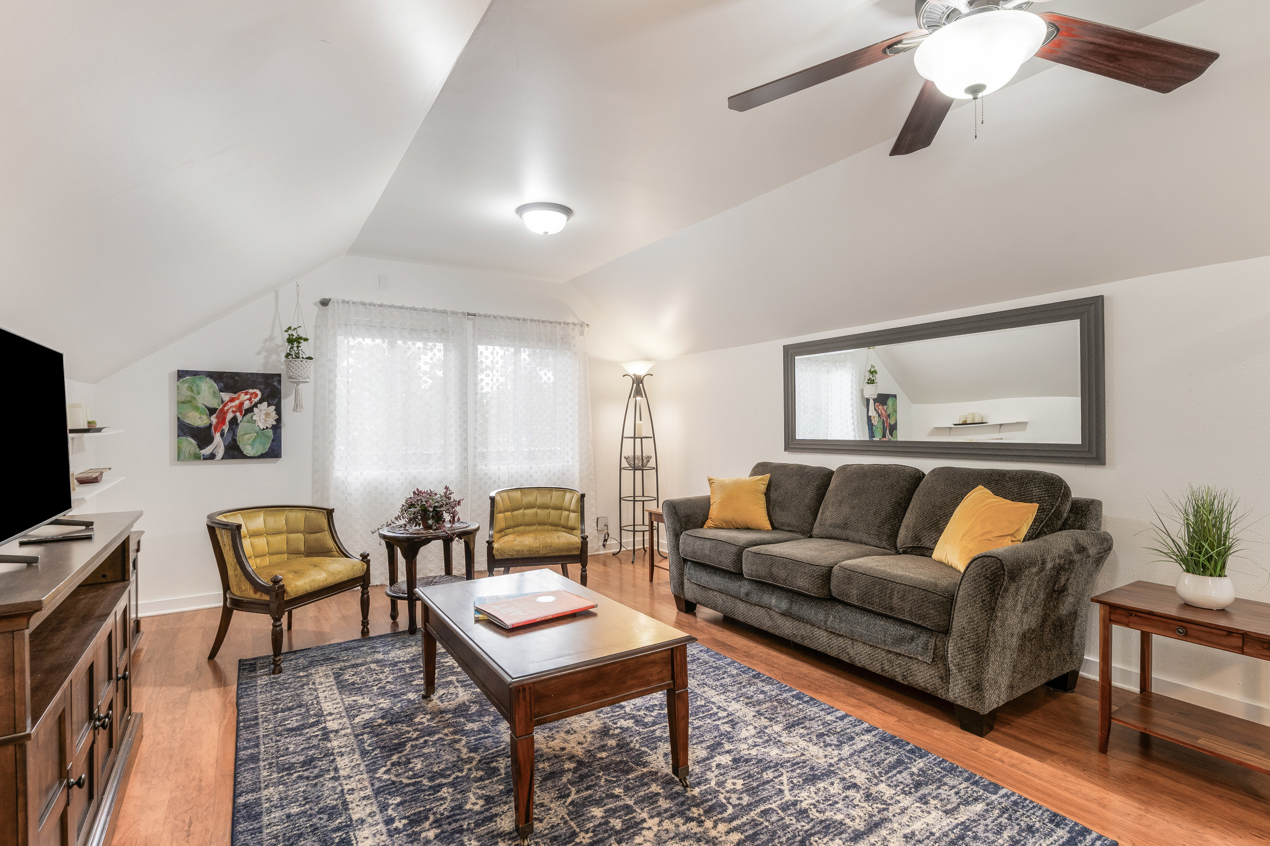 Charming upstairs unit with tall sloped ceiling