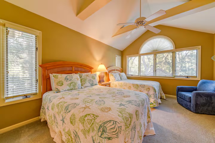 Double Queen bedroom features vaulted ceiling and tons of natural light