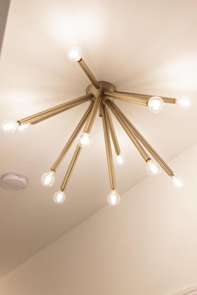 Modern elegance meets warm ambiance with this stunning chandelier, perfect for a cozy and stylish stay.