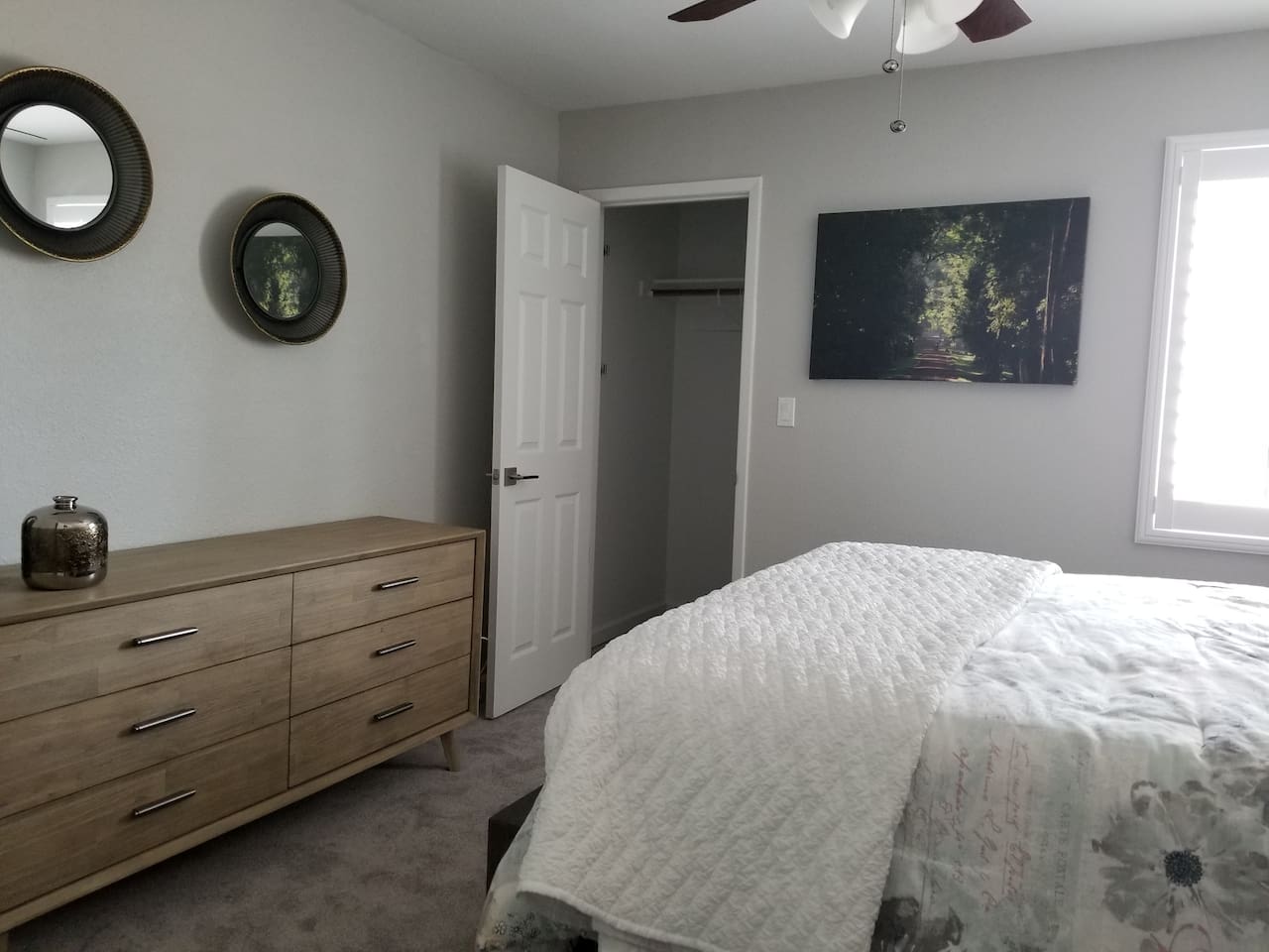 Plenty of space in this guest room. Walk in closet, plantation shutters, and comfort galore.