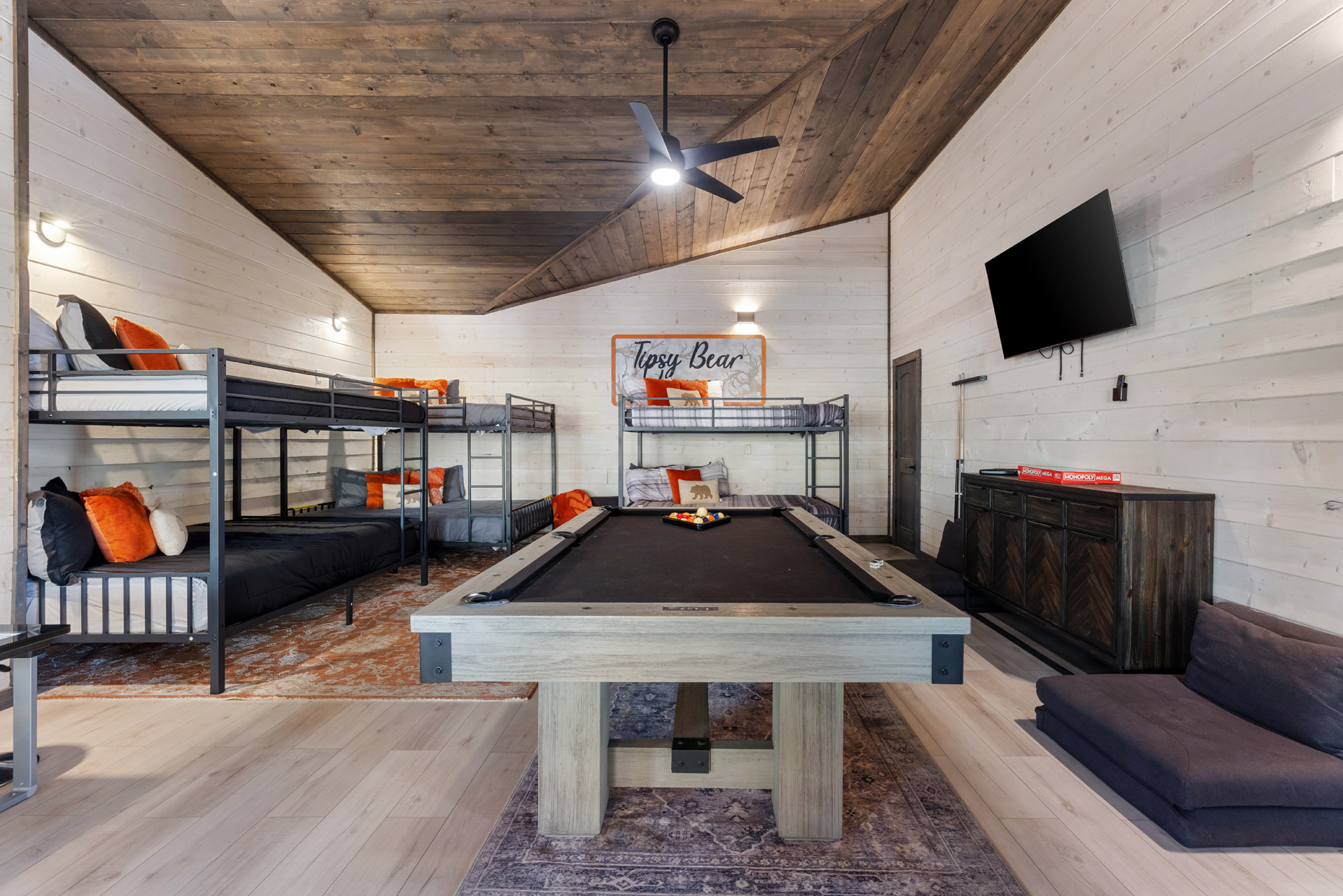 The first of two bunkrooms/gamerooms is off the kitchen and offers a pool table and TV.