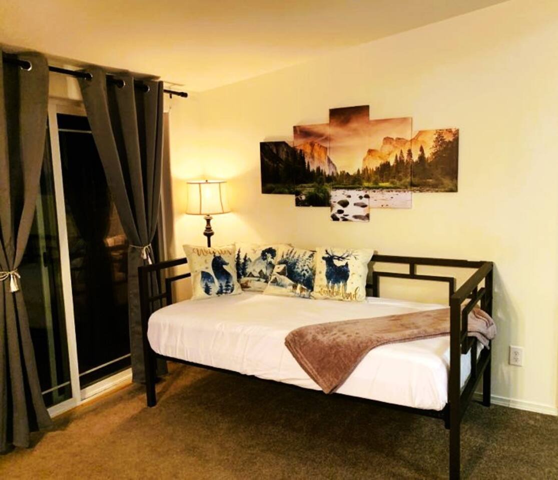 Day bed with a view of the Sierra Mountain.