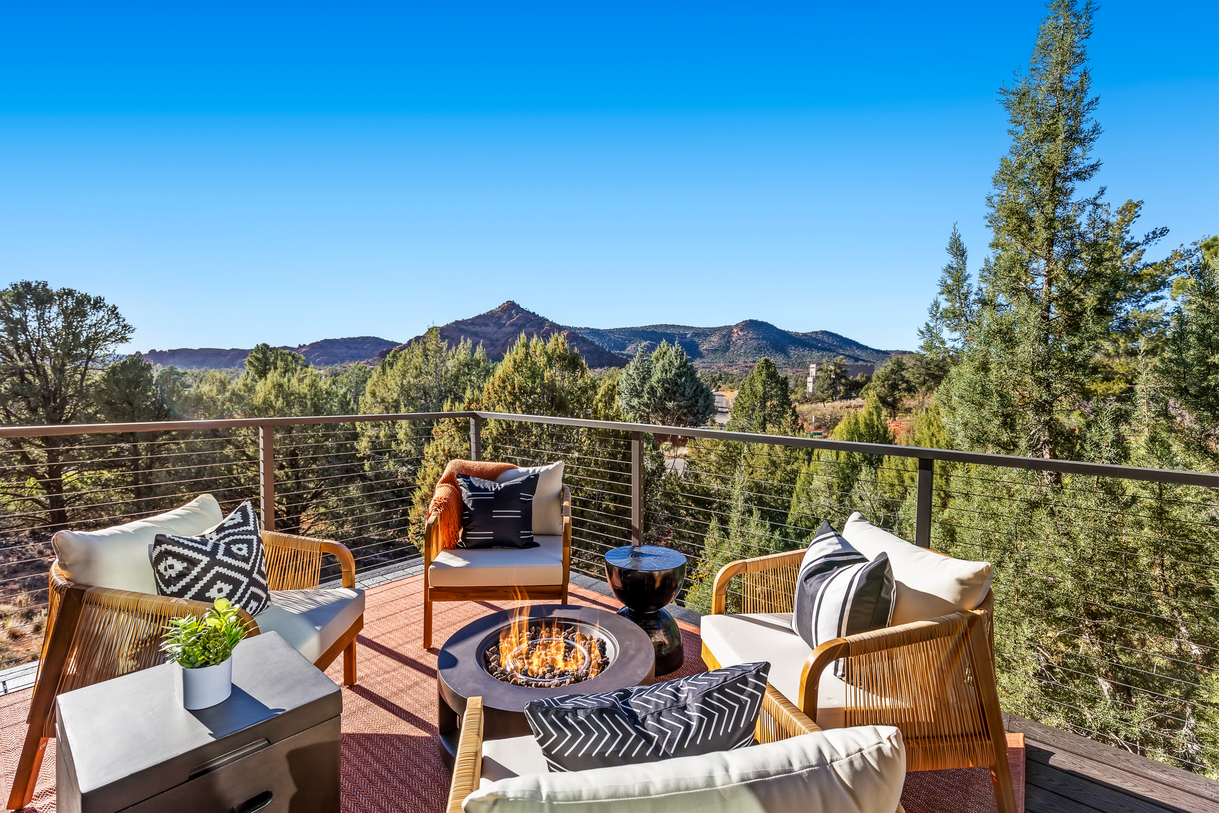Relax around the fire on the upper deck with open views of Sedona’s red rock landscape and surrounding desert, creating an ideal spot to unwind any time of day.