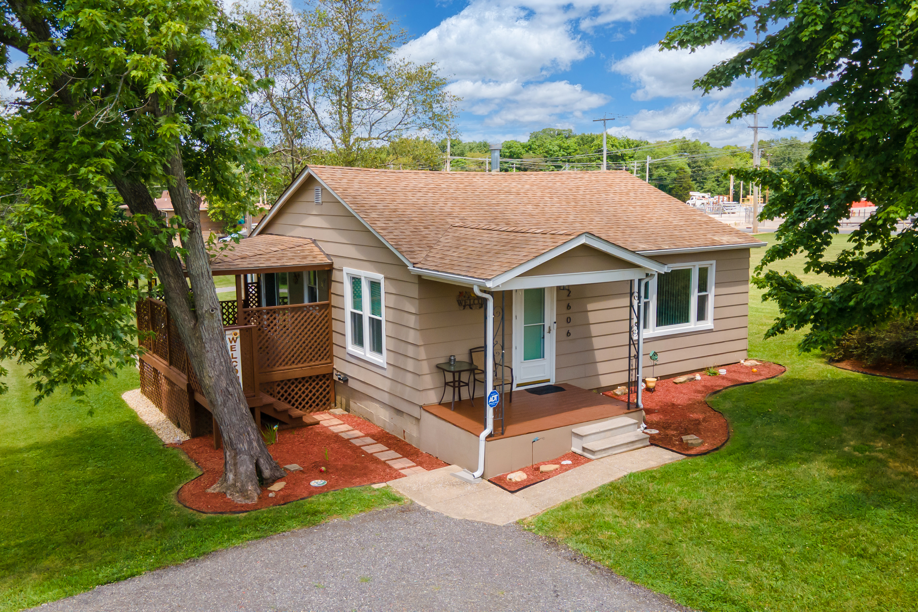A welcoming entrance. Beautiful landscaping leads you to the covered front porch—a perfect spot to enjoy fresh air and shade.