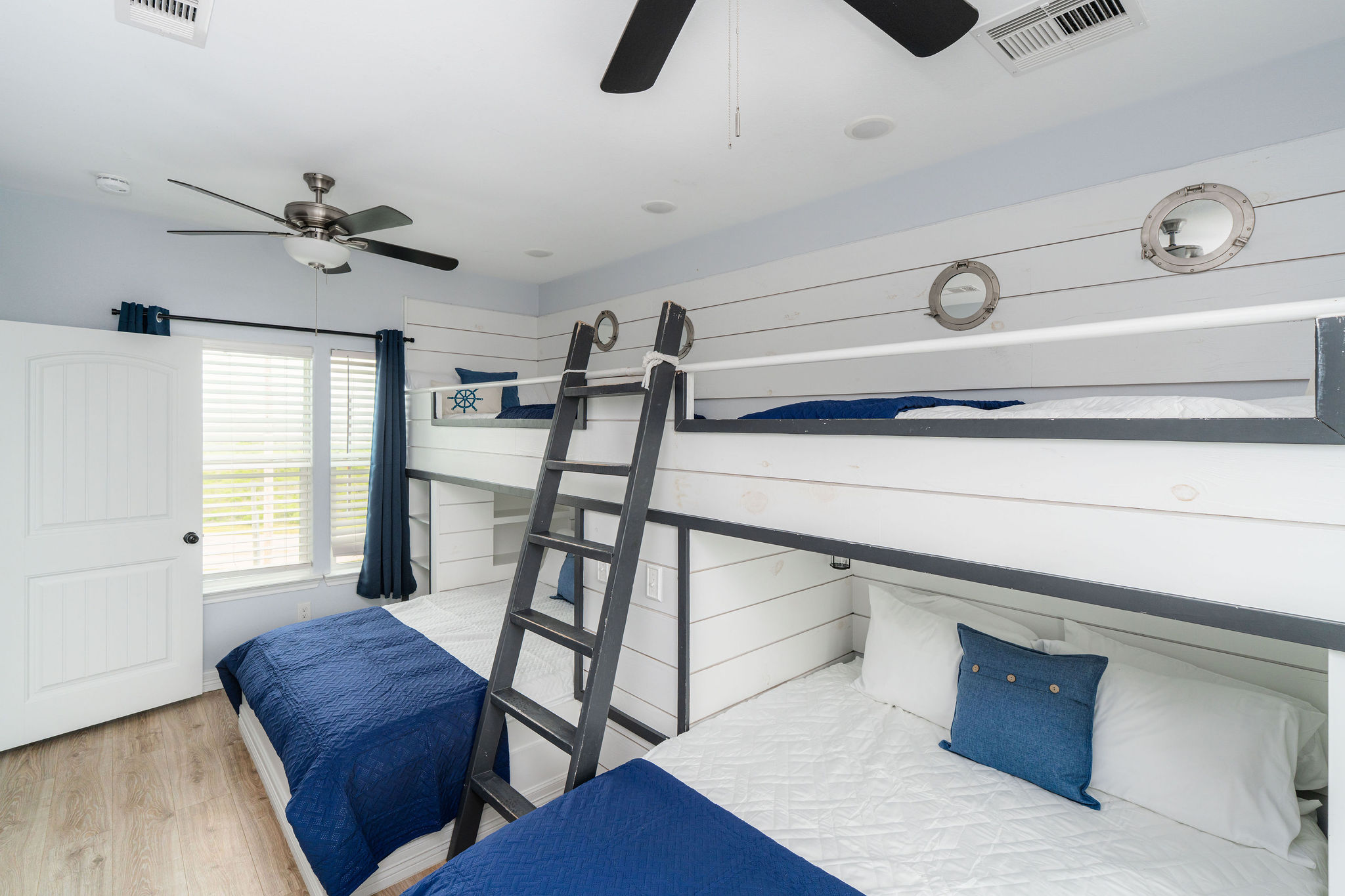Bunk Room alt (upstairs) — nautical details, sleeps up to 6. Kids own this floor.