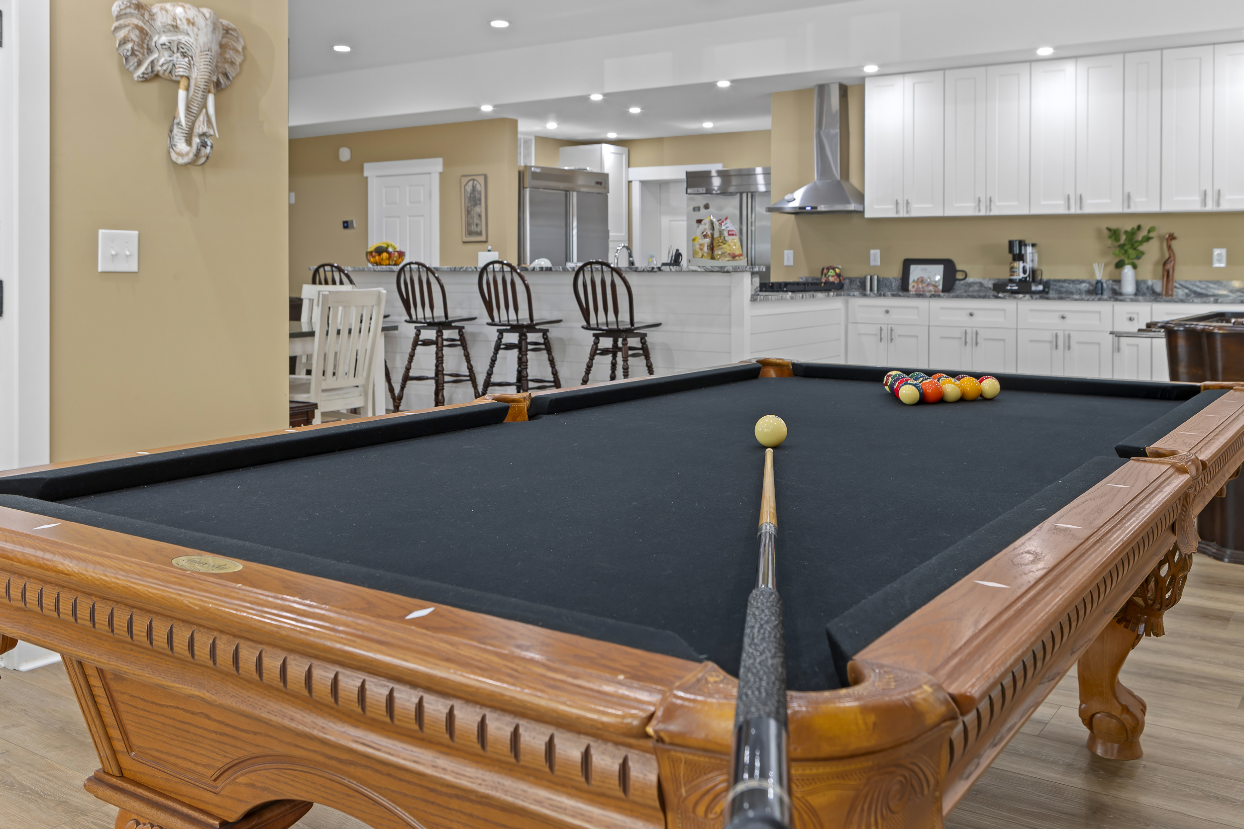 Game Room: Dive into fun with a classic pool table and stylish bar seating—perfect for friendly matches!