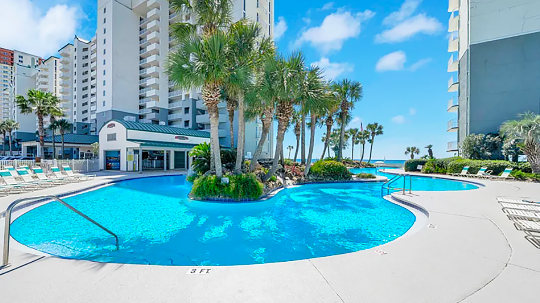 Large lagoon pool with plenty of poolside or beachfront seating.