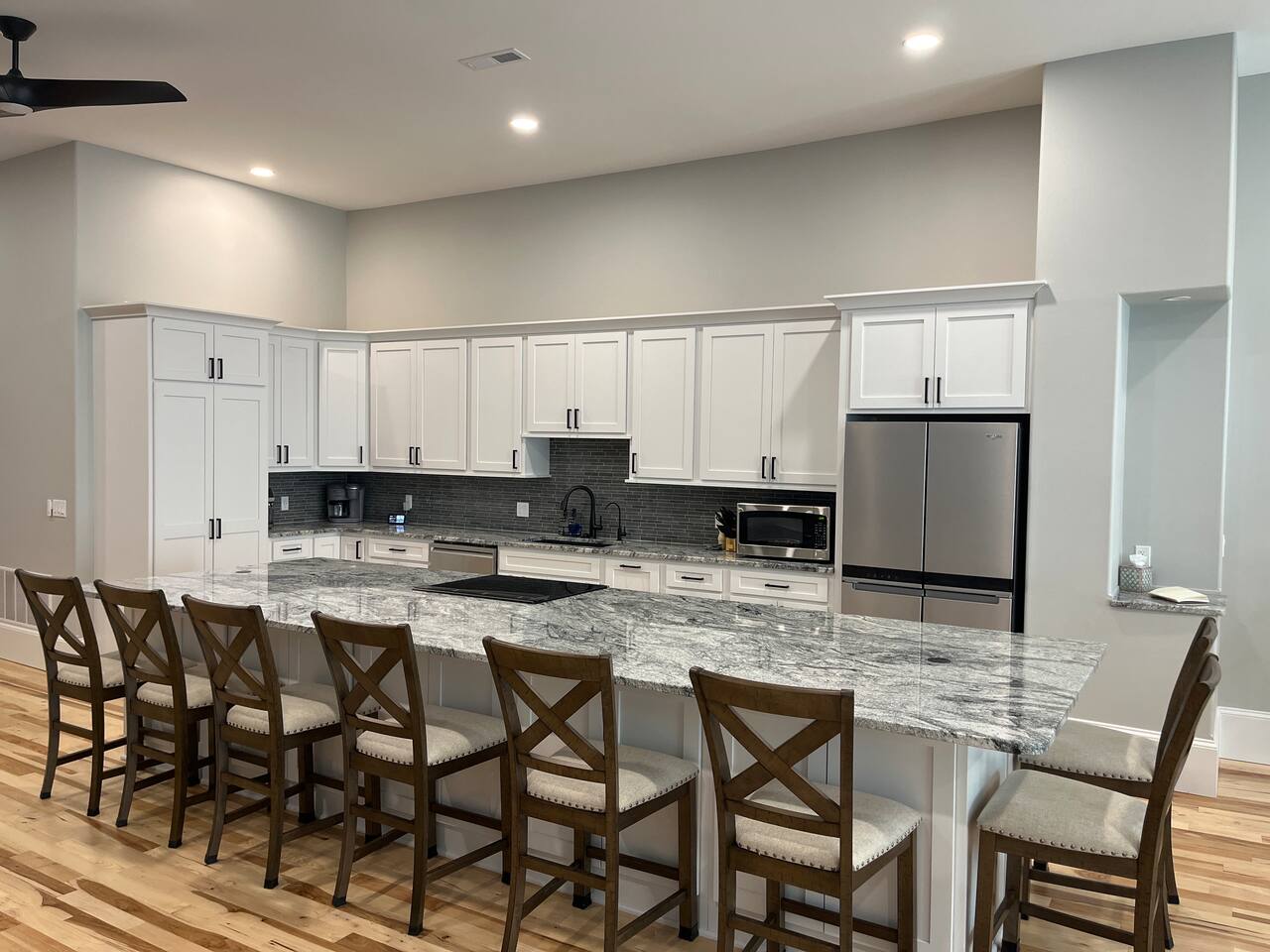 The lights are voice activated!  If you say ‘Alexa, turn on the kitchen lights’ she will turn them on for you.  You can also ask her to dim the lights or turn them off.  For a complete list of Alexa controls look in the welcome book.