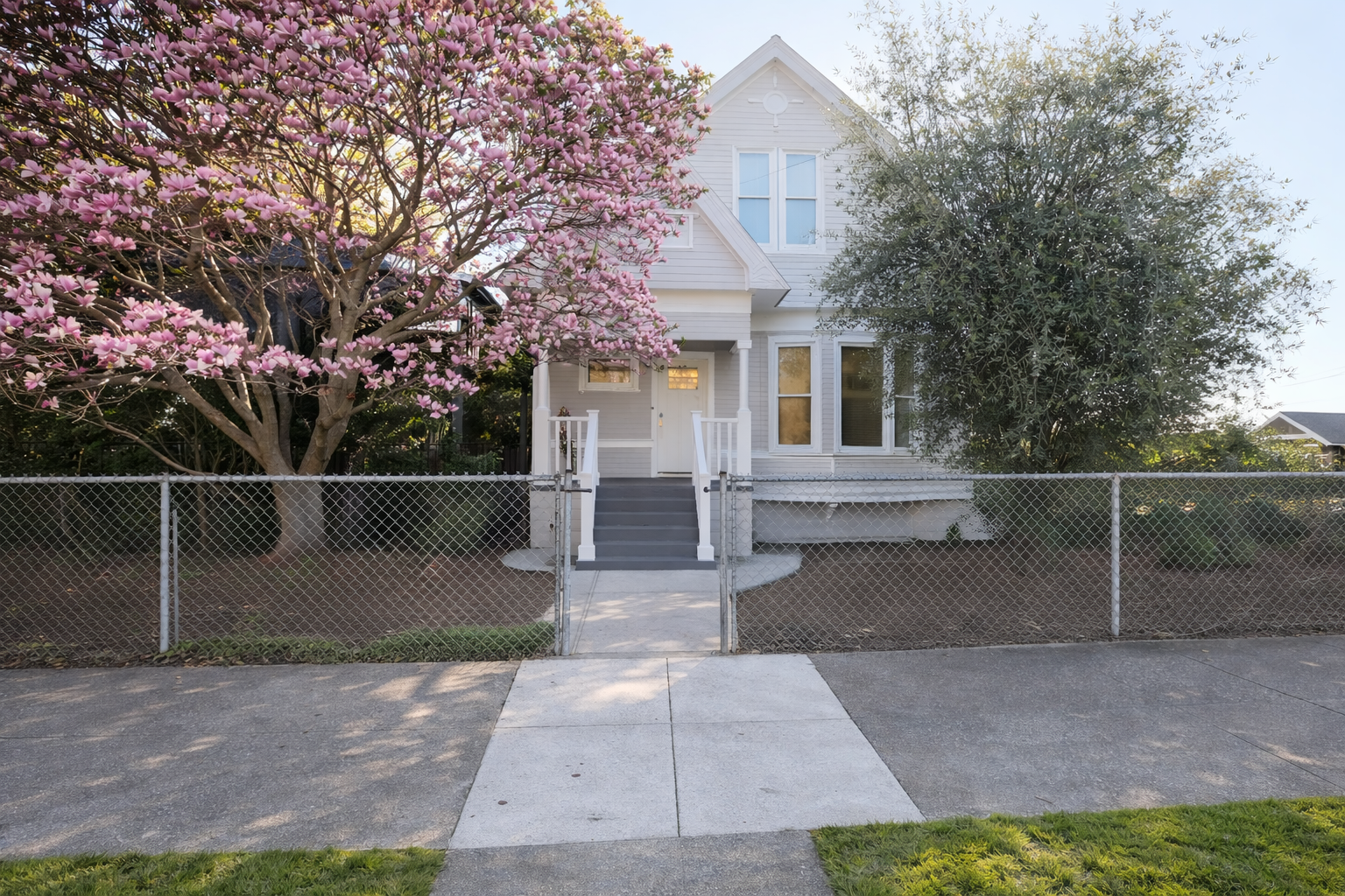 Welcome to your home away from home! Enjoy the blooming magnolia and classic architecture of this charming residence.