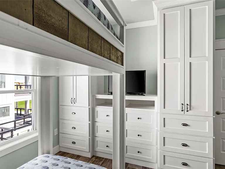 Crystal Paradise Bedroom 5: Bedroom 5 features a bunk bed with built-in cabinets for extra storage—perfect for kids or guests.
